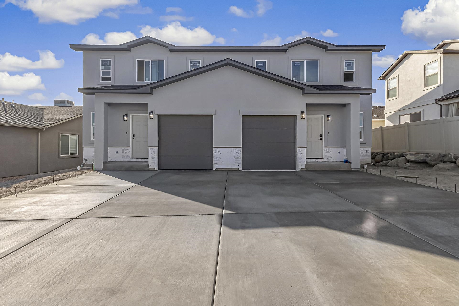 Gorgeous Brand New Construction lock and leave in the lovely Legends Subdivision! Live in one unit and rent the other to help pay your mortgage or rent out both of these beautiful units! Soft gray colors paint the walls throughout with beautiful matching cabinets, countertops, vinyl flooring, tile, and carpet. All appliances included. Beautiful primary suites with large walk-in closets, and spacious bathrooms with a large walk-in showers. A patio and xeriscaped yard maintained by the HOA makes for easy maintenance. Refrigerated central air to keep you cool in the hot summer months. The HOA will be responsible for the landscaping after closing. These homes are ready to move in and fall in love with!