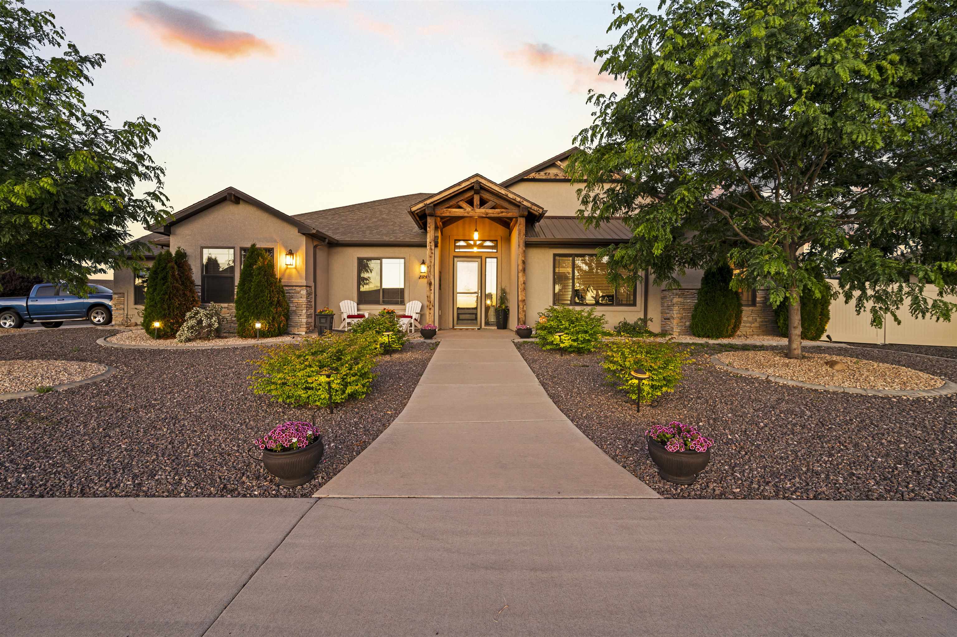 Award-Winning Dahl Built Homes constructed this impressive beauty! High-end upgrades and finishes throughout. Superb location: 4min to Adobe Creek Ntl Golf Course, 6min to downtown Fruita where local craft beer and local eateries abound, minutes from trailheads, horse-riding, fishing, rodeo, wine-tasting, outdoor activities. Bike world famous single track trails and enjoy the dynamic 30+ yearly events, festivals, and farmer's market close to home. Rustic wood beams adorn vaulted ceilings and accentuate walls, generous quartz countertops in inviting open kitchen, floor to ceiling shelving in oversized pantry, fill the wine cooler with your favorites from local wineries, custom dimmable lighting in primary bedroom ceiling tray, dual shower heads in primary bath, exceptional outdoor living space with built-in natural gas fire pit & two custom pergolas, RV parking accommodates your camper/toys, corner lot, great schools nearby - come fall in love with the home and the best of Fruita! All information including but not limited to square footage, measurements, acreage & lot measurements, HOA/CIC fees, pricing & availability are subject to change/error, without notice. Buyer (s) to verify all.