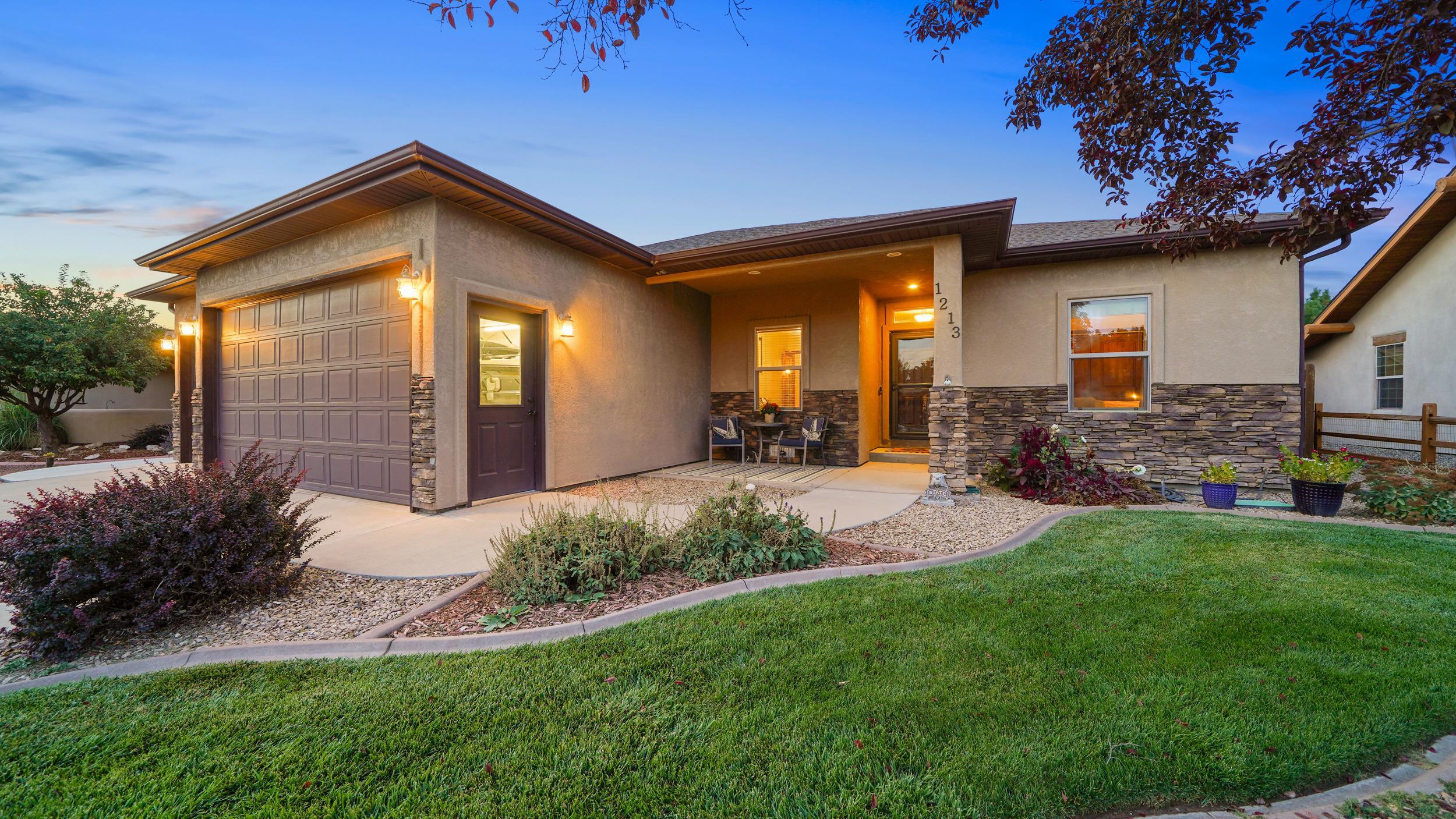 THIS IS IT! Step inside this gorgeous 3 bedroom + office, 2 bathroom Fruita home boasting a fantastic open concept floor plan, and custom features inside & out! Check out the high quality finishes- hardwood flooring, solid wood doors & trim, vaulted ceiling with decor shelf, built-in speaker system in living room & primary suite, solid surface countertops, and ample cabinetry. The hardwood flooring continues into the large sequestered primary suite, including a double vanity, walk in shower, jetted soaker tub, walk-in closet, and a private entrance to the backyard. The primary suite has its own patio to enjoy the cool Fall evenings. Don't forget the easy access to the hot tub, too!   As if beauty and pride of ownership are not enough, major systems have been upgraded recently!! Hot water heater (2021), forced air HVAC system (2023) with radiant heat system still in place, and stainless steel kitchen appliances (around 2019). This home needs NOTHING. This property is not only move-in ready, but also includes upgrades to be enjoyed for years to come.   Step outside to the large covered patio, plus the sandstone patio ready for evening gatherings around the fire pit, or sit and listen to the tranquil sounds of the rock water feature. Landscaping is mature and makes the yard your own private Western Colorado oasis. Manicured front and back landscaping all fed by automatic drip system and additional drip set-up for garden boxes or potted plans as well. Hot tub will also stay making this yard the absolute cherry on top.   Quick and easy access to Fruita Recreation Center, Family Health West, and I-70.  Don't wait, this home is sure to be desired by many waiting for the perfect property to call their own!