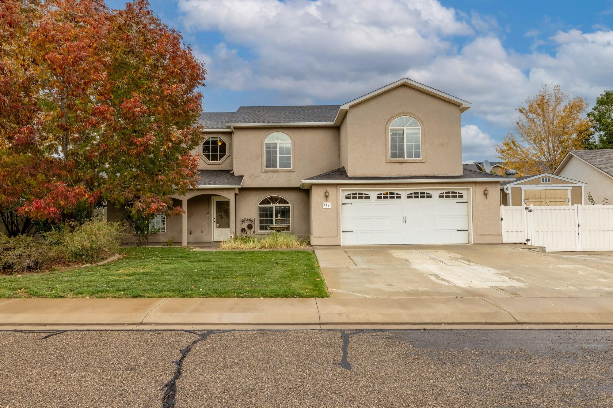 Welcome to Fruita! This beautiful home features 4 bedrooms, 3 bathrooms and 2 car garage. The primary suite is located on the main floor with a spacious bedroom, walk-in closet and 5 piece bath. Upstairs you will find a sizeable family room with separate office, laundry room, 3 bedrooms and bathroom. Custom hickory cabinets throughout the home including kitchen, bathrooms, pantry and laundry room. Granite tile countertops, recessed lighting, gas fireplace, covered patio and front porch are a few of the many gems this home has to offer. Fully fenced backyard features a custom dog run, covered patio, above ground pool and a hot tub. Central air conditioner and heater replaced in 2023, water heater replaced in 2022. Walking distance to Little Salt Wash Park and minutes from Fruita's charming downtown. Don't miss out on this wonderful place to call home - call Raine Fleming at 970-728-6115 or your real esate professional today!