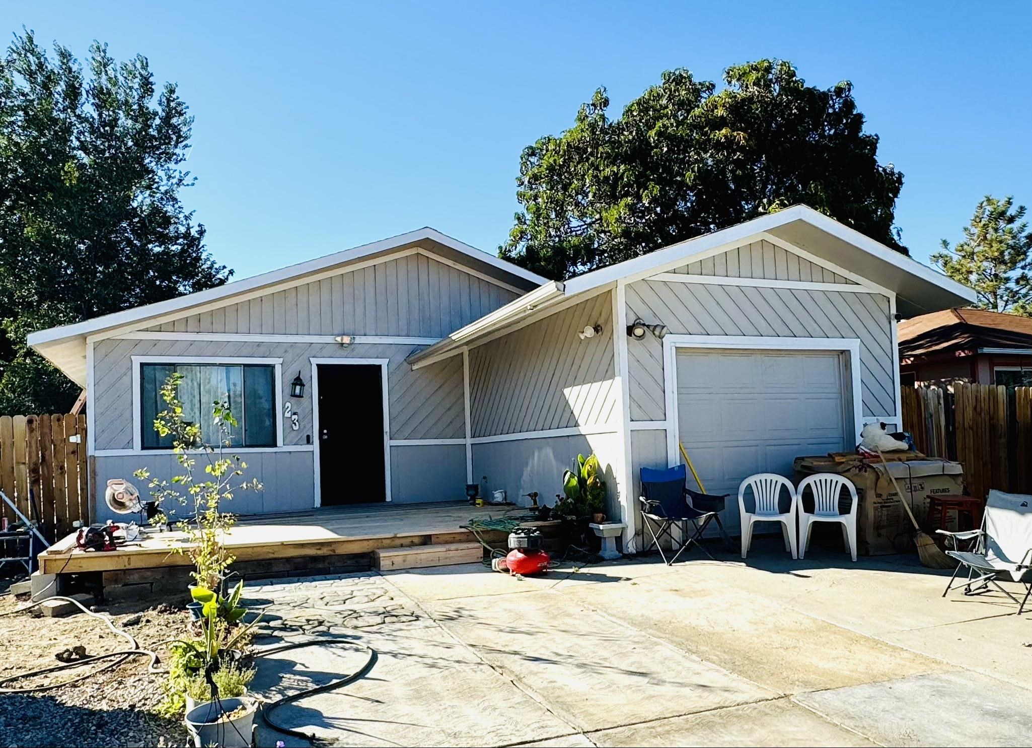 Welcome Home! Absolutely wonderful three bedroom, two bath home with 1224 square feet on one level, one car garage & RV Parking! This lovely home was recently updated in 2021 with all new flooring, new exterior & interior paint, & lovely new texture. The kitchen is in the heart of the home where you can prepare your favorite flavorful meals for those you love the most with beautiful new granite countertops, new stainless appliances, new hickory cabinets and great central location. The layout of the home is a perfect place to relax and take comfort with loved ones and great for entertaining on all new front deck. Enjoy additional exterior upgrades such as abundance of parking with extended front driveway and front xeriscape. The exterior also features shed, fully fenced yard with two new side gates, irrigation water available, RV Parking and NO HOA!! Enjoy the peace of mind, privacy and freedom to make this your very own home! Enjoy great sized yard with tons of possibilities for gardening, raised garden beds & more! Motivated seller! Bring offers!