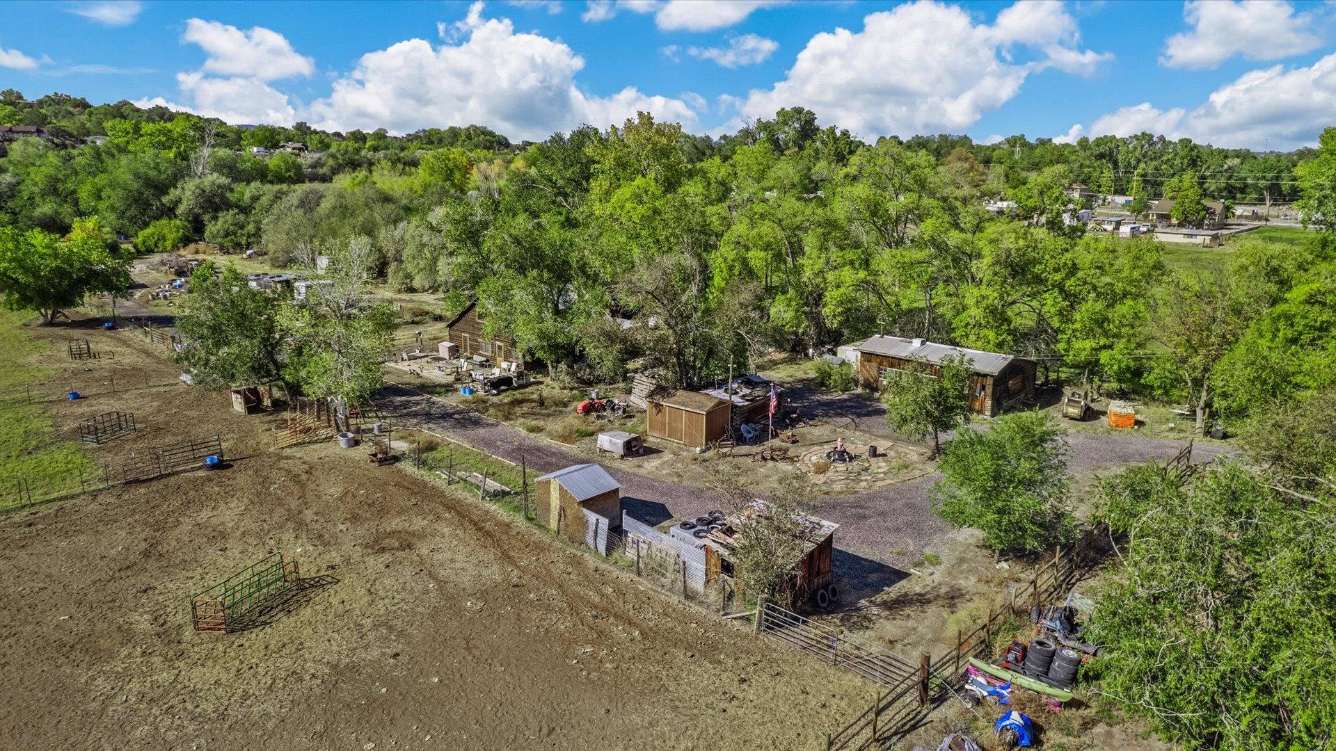 This is a rare opportunity to purchase 9.3 acres, a true Colorado homestead that has been in the family for decades. The property consists of the main home and numerous outbuildings, RSF 8, in close proximity to the Grand Junction city core. Flat, buildable acreage. You will find this property to be warm and inviting, with 1364 sf, four bedrooms, and one full bath. The Seller has just had all new upgraded Anderson Windows installed throughout. There are many built-ins, plenty of storage, a mud room, a free-standing gas fireplace, and so much more. These gems don't come up very often. The property will need to be annexed to the city upon further development. City sewer, Ute water, and Xcel are in place on the property. Included in the sale are 4 Shares of Redlands Power & Water. This is a beautiful property with abundant wildlife, views, and a real country feel, but so close in to all conveniences.