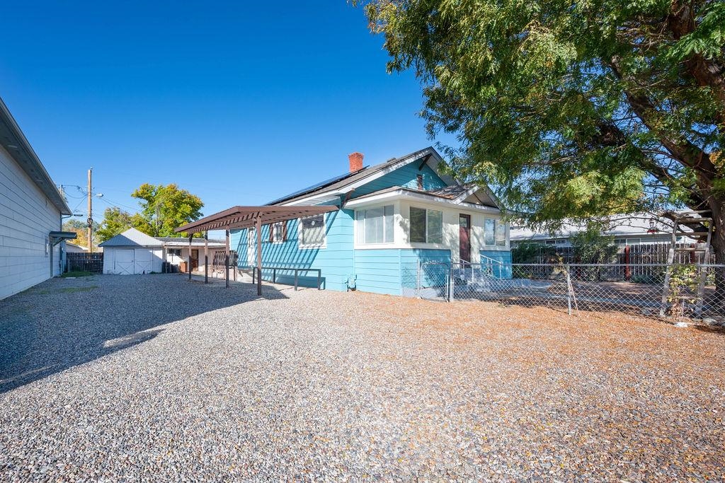 Are you ready for a turn-of-the 20th Century home, and a quick stroll to downtown Fruita? This is the home for you! Cute and cozy, this 3-bedroom 1 bath home has had multiple upgrades and is ready for your immediate occupancy. The kitchen area was completely re-imagined with a center island that opens to the dining area and living room, new appliances including gas range/oven, range hood, refrigerator, dishwasher, and microwave. A new roof and solar system were recently installed. The yard is essentially xeriscape, and there are raised beds included for your new garden. Talk with your agent about getting the list of upgrades. The home 1 block from Shelledy Elementary and across the street from Fruita Middle School. Plenty of room for all sizes of RV parking. Make an appointment to view today!