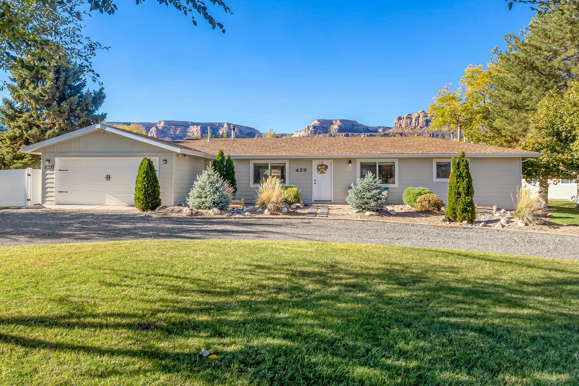 Huge Price Improvement!!! This property screams value. Get in there quick because this one won't last long at this great price.   Welcome to your dream home! This charming property features a spacious and open  design, perfect for modern living and entertaining. Enjoy a large yard that offers plenty of space for gardening, play, or relaxation, all while taking in breathtaking views of the iconic Monument. The inviting sunroom is ideal for basking in natural light during morning coffee or cozy evenings with a book. With the convenience of RV parking and an oversized garage providing ample storage for vehicles and outdoor gear, you’ll find everything you need right at your fingertips. Plus, a newer roof ensures durability and peace of mind for years to come. This property combines comfort, functionality, and beautiful surroundings—don’t miss the chance to make it your own! Schedule a viewing today!