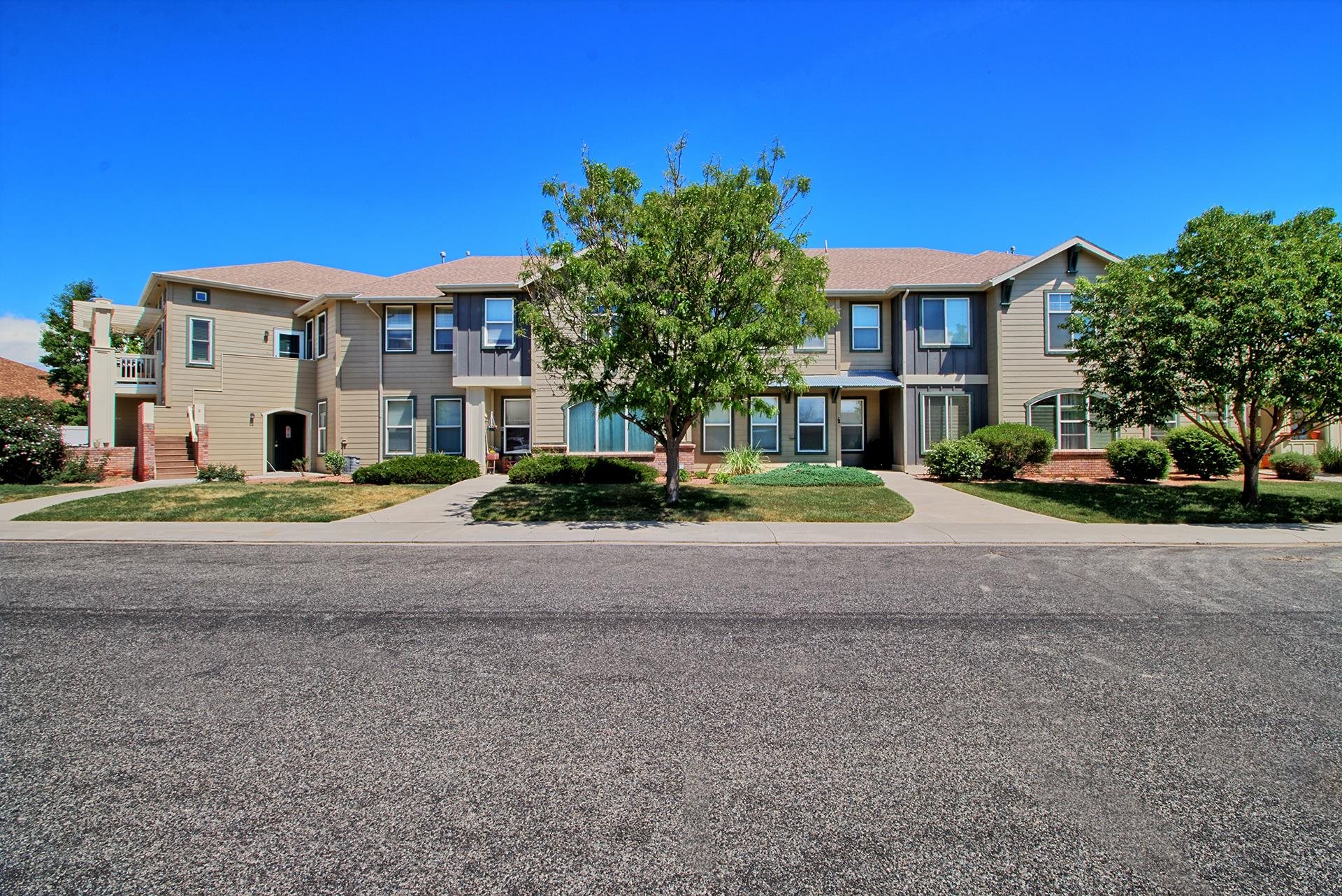 This upgraded 2-bedroom, 2-bathroom condo offers a perfect lock-and-leave lifestyle with an attached garage and the comfort of home in a desirable North Grand Junction community. The beautifully remodeled kitchen showcases quartz countertops, a sleek undermount sink, stainless steel appliances, and bright white farmhouse cabinetry, creating a chic, inviting space to cook and entertain. An additional den/office makes an ideal work-from-home area or can serve as a non-conforming bedroom. Both bedrooms are generously sized with ample closet storage, while the two full baths include tasteful vanities and tub/shower combos. A spacious laundry room with extra cabinetry provides added convenience, connecting to the attached garage. Enjoy the outdoors from your private covered patio, overlooking beautifully manicured grounds maintained by the HOA. The community offers amenities like a walking path, private pond, and park for outdoor enjoyment. HOA dues cover water, sewer, and trash, allowing for truly worry-free living. This unit is ideal for both rental investment and owner-occupants seeking a low-maintenance home for an on-the-go lifestyle!