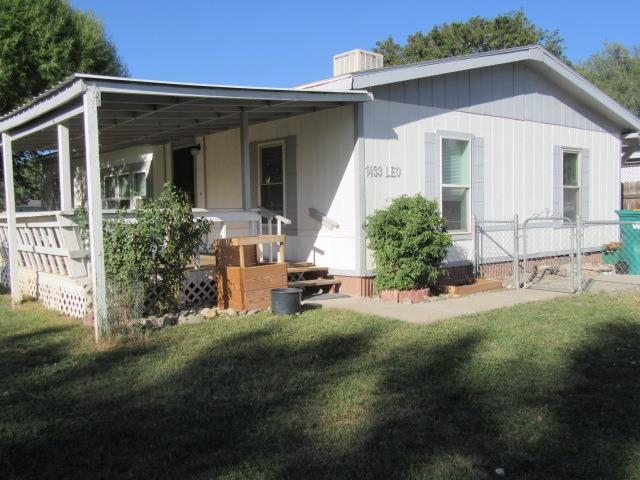 Corner lot in Holly Park subdivision in northeast Fruita. Conveniently located near shopping, hiking trails and bike trails in the Fruita area.  Large lot with mature trees, fenced in for your convenience. Covered patio for sitting and having a warm cup of coffee in the morning or ice tea in the afternoon.  Living room and kitchen are open and airy.  Primary bathroom is 11'8" X 8'3" and includes a double sink, bathtub and shower.  Two other good-sized bedrooms and a full bathroom and laundry room.  One covered parking spot and up to 3 spots for parking other cars.  A storage shed for tools or outdoor toys.