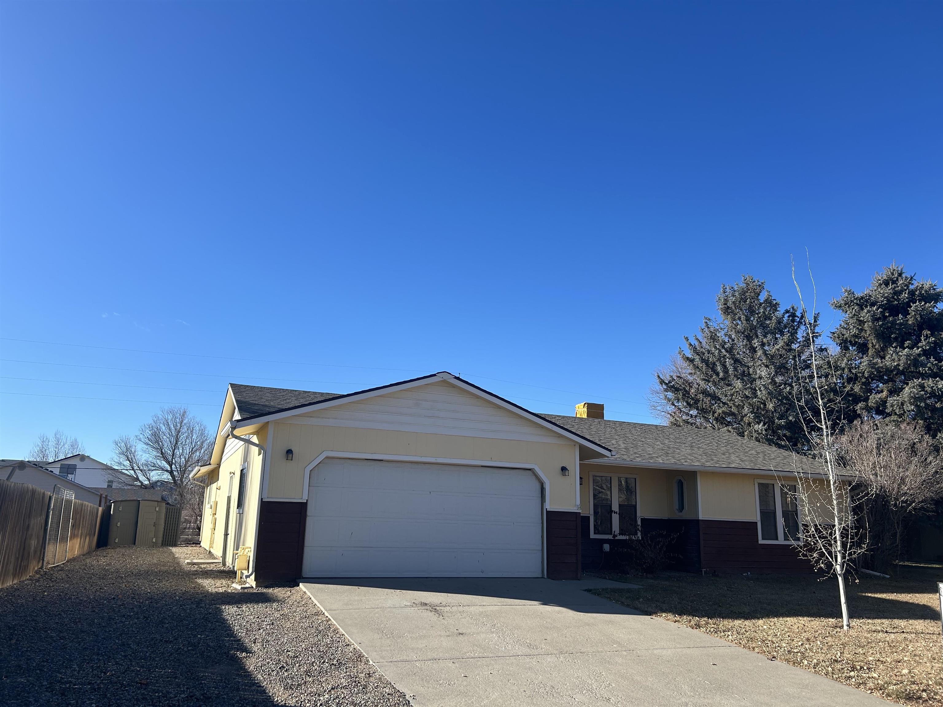 Enjoy peace of mind with a brand new roof, evaporative cooler, hot water heater, and kitchen appliances.  This is a great ranch style home with RV parking with a large fenced yard and a storage shed.  Sprinkler system in place front and back with irrigation water.   New flooring, paint, doors, vanities, cabinets. counters, lights, etc.  Not a drive by- Get inside!  There is a large family room that could be easily converted to a 4th bedroom. This home is light and bright and ready for new owners.  Great location in an established neighborhood, with easy access to downtown Fruita.