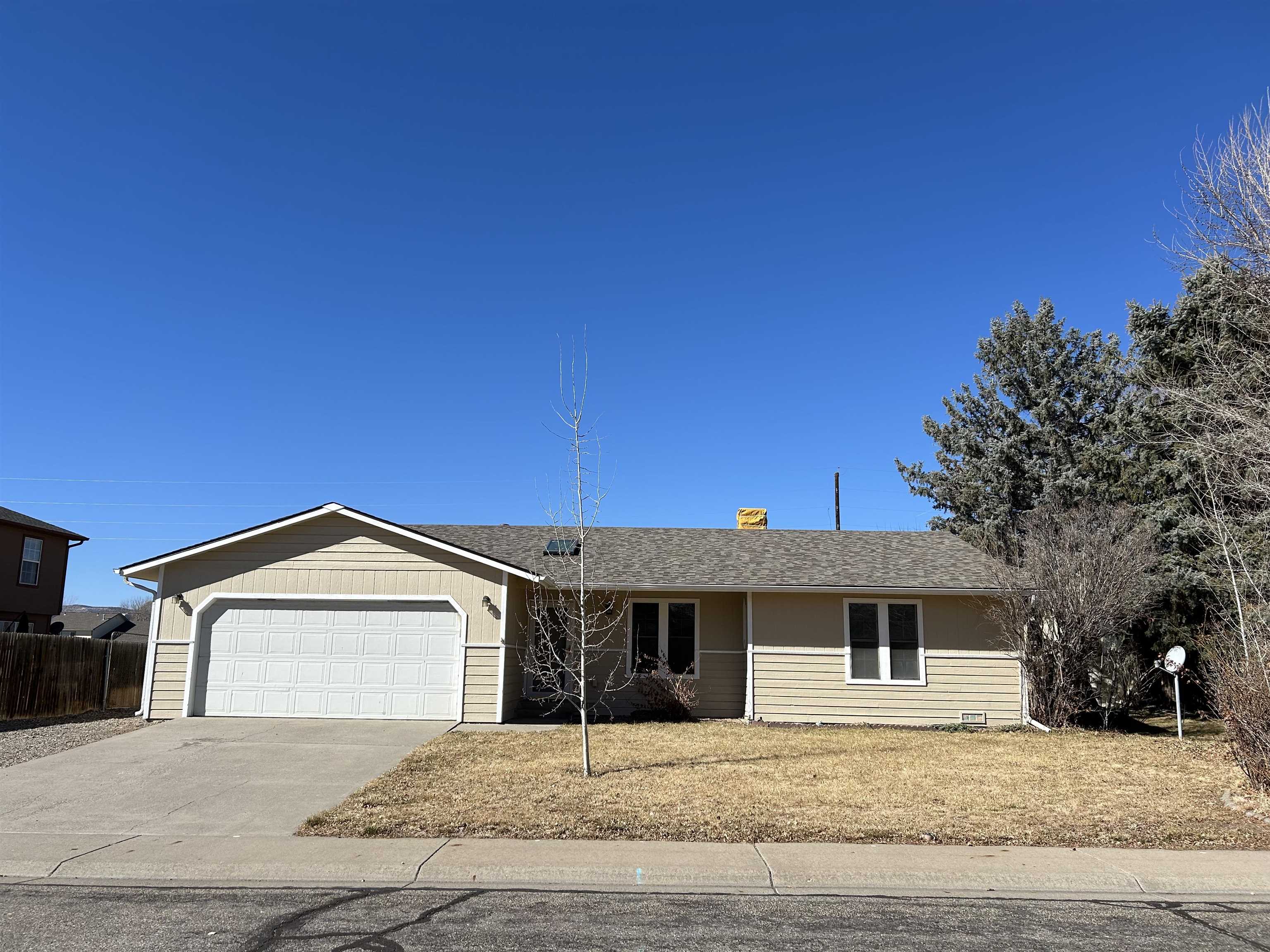 Enjoy peace of mind with a brand new roof, evaporative cooler, hot water heater, and kitchen appliances. Fresh exterior Paint, and backyard has been prepped for sod or hydroseeding.  This is a great ranch style home with RV parking with a large fenced yard and a storage shed.  Sprinkler system in place front and back with irrigation water.   New flooring, paint, doors, vanities, cabinets. counters, lights, etc.  Not a drive by- Get inside!  There is a large family room that could be easily converted to a 4th bedroom. This home is light and bright and ready for new owners.  Great location in an established neighborhood, with easy access to downtown Fruita.