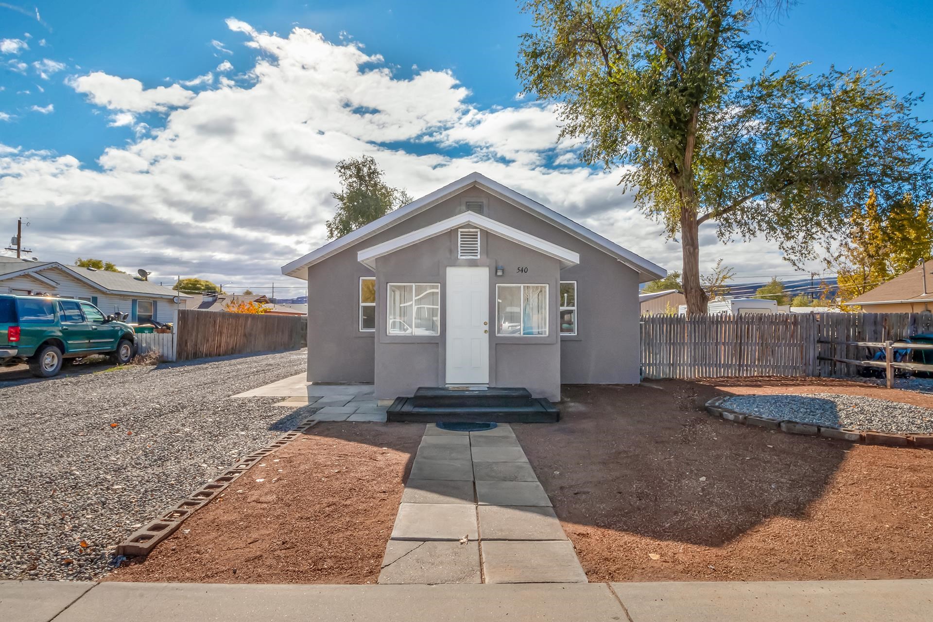 Cute Fruita Cottage situated on .20 of an acre lot. Great location just steps from the updated/refreshed Reed Park and downtown Fruita. Home features stucco exterior, several updated windows, fresh interior paint, new tile floor throughout plus new mini-split for heating and cooling. Sunny sitting area at the front of the home opens to the living room and the two bedrooms. One bedroom is non-conforming (closets are located in the adjacent sitting room) Kitchen features metal cabinets and sink (retro/original) new countertops, electric range/oven, refrigerator and stackable washer/dryer. Dining room has access to the back deck and yard. Fully fenced back yard with alley access, RV gate/parking and detached garage/shop. Check with the City of Fruita regarding the possibility of building an ADU on the property. Low maintenance landscape front yard and back yard is ready for whatever you want.