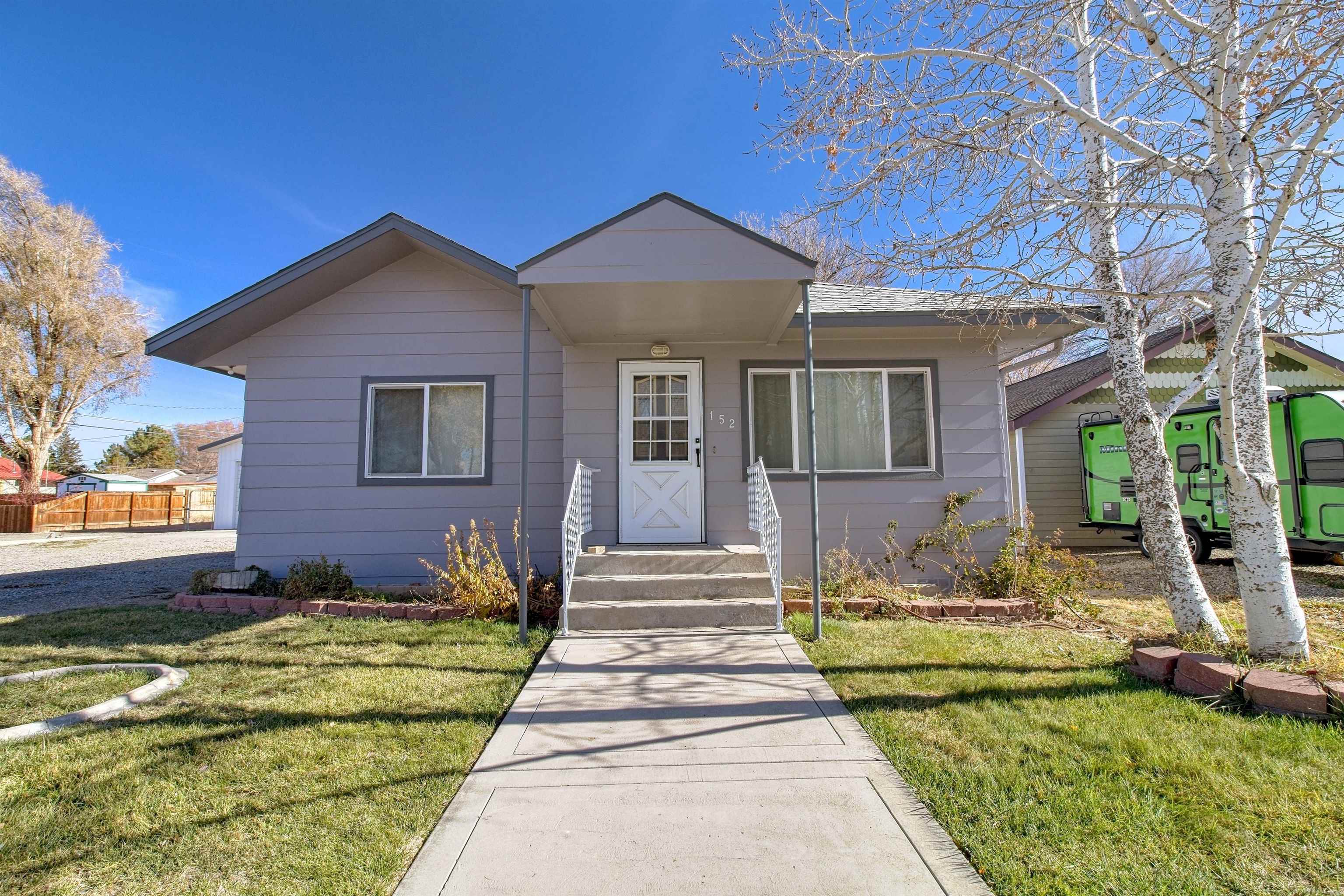 The seller is providing a $5,000 flooring allowance with an acceptable offer. Seize this unique opportunity to make this home yours today. Experience the best of both worlds, as Downtown Fruita is just a short walk away, offering local dining, distinctive shops, and community events. The area is renowned for its breathtaking trails and outdoor activities, making this property an ideal combination of comfort, convenience, and creativity. It features ample RV parking, allowing for easy vehicle storage without compromising yard space. This expansive 1,728 sq. ft. ranch-style home sits on a sizable lot and includes four bedrooms, two bathrooms, and dual living areas. Benefit from extensive parking options, including RV parking, a carport, and a large 28 x 34 detached shop with built-in storage, perfect for your next project. The lovely backyard, complete with a covered patio, is ideal for entertaining and relaxation. The home's exterior is in excellent condition, featuring new paint, updated dual-pane windows, and an owned solar system. Inside, the kitchen is bright and spacious, equipped with a large island, oak cabinets for ample storage, and additional built-in cabinets. This residence is more than just a home; it represents a lifestyle waiting to be embraced. Do not let this exceptional opportunity to own a piece of Fruita slip away. Schedule your private tour today and turn this dream home into your reality.