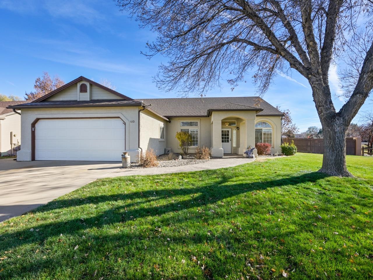 Your dream home awaits in the coveted Comstock subdivision of Fruita, Colorado! Ideally located near downtown, this home offers easy access to Fruita's vibrant amenities and outdoor activities. With an open lot to the south, enjoy uninterrupted views of the Colorado National Monument, adding privacy and natural beauty to the property. This home is thoughtfully designed with a slab foundation and a zero-entry layout, providing easy access with no steps. Inside, the bright living room features large picture windows, while French doors lead to a versatile front room perfect as a home office, den, or extra bedroom. The spacious kitchen and dining area include a gas fireplace, ample cabinets, and an island, ideal for entertaining. Relax in the charming sunroom, a perfect retreat for unwinding with your favorite beverage. The primary suite offers a walk-in closet and en-suite bathroom with a no-step shower for added comfort. Two additional bedrooms share a second full bathroom. The two-car garage, equipped with built-in workbenches and a tool rack, is ready for projects, and the fully landscaped, low-maintenance yard includes a storage shed for convenience. Don’t miss this opportunity to make this stunning home your own. Schedule a showing today!