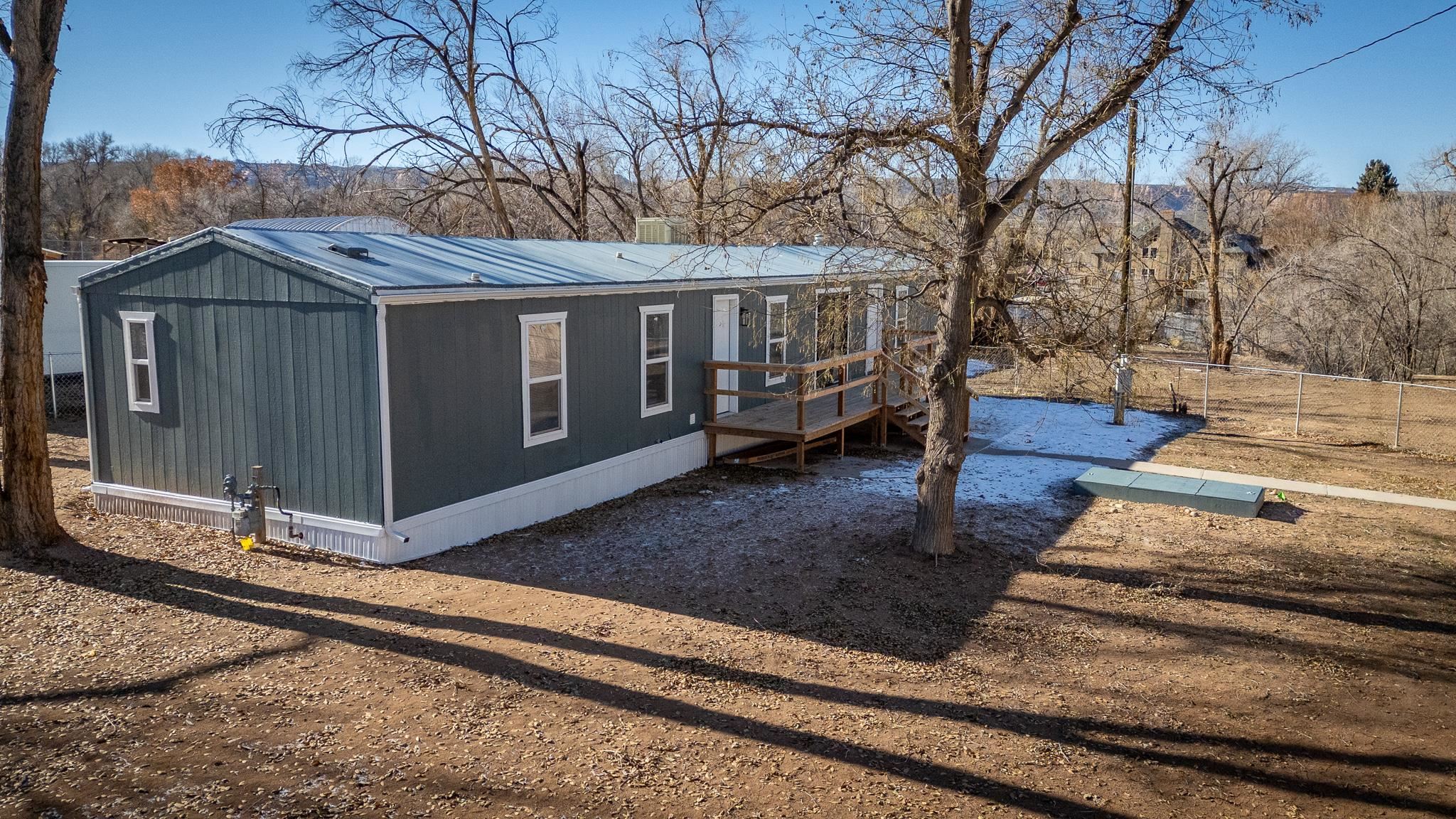 Rare find in the Redlands on .78 acres at this price.  Close in and a private area with no HOA.  This is a light and bright 3 bedroom, 2 bath manufactured home remodeled in 2024 with new kitchen, baths, appliances, lighting, and more.   Room for all your toys, equipment, or build an ADU.  Move-in ready.