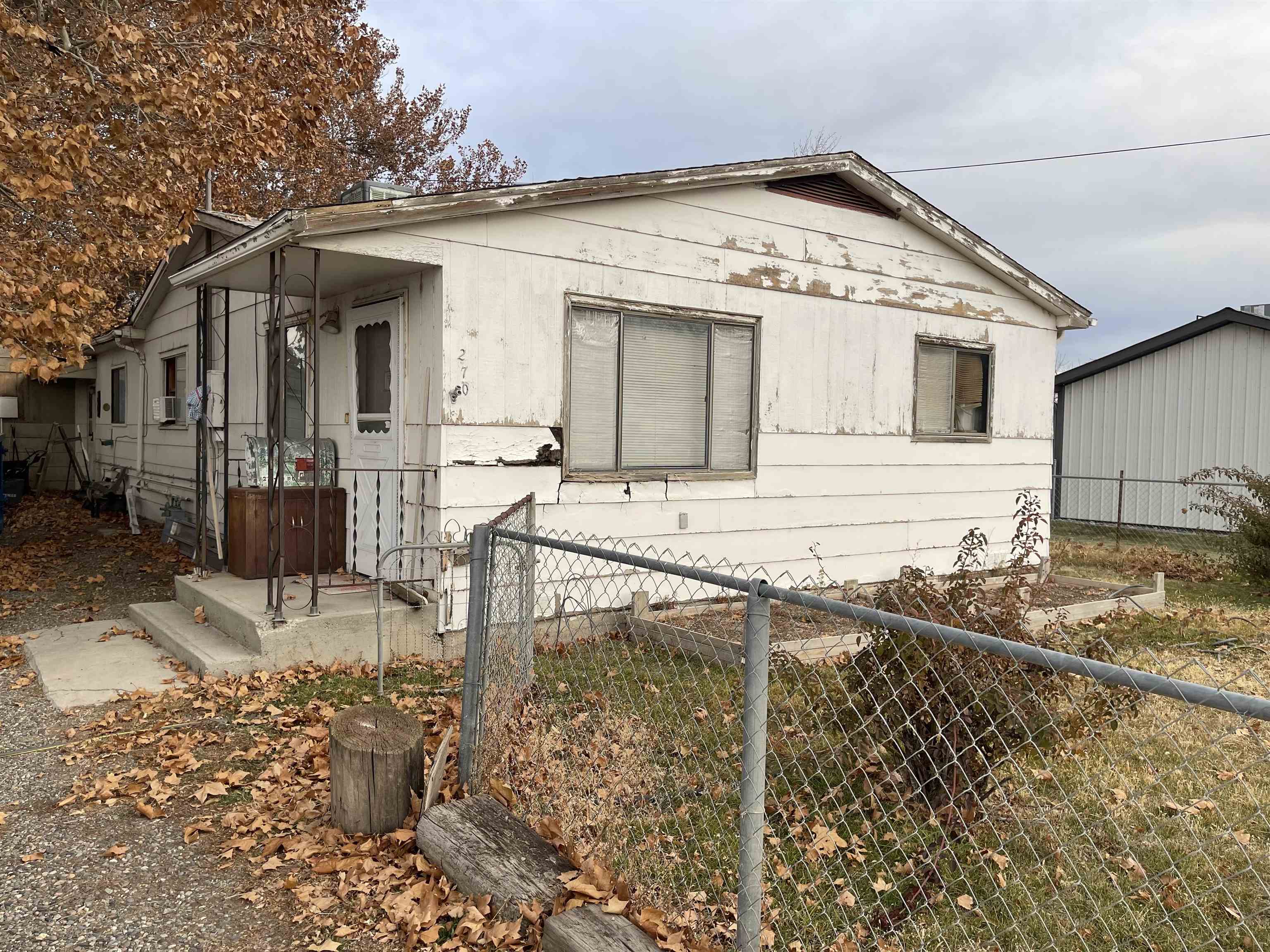 Great location, fenced yard. Great fixer upper. Convenient location.