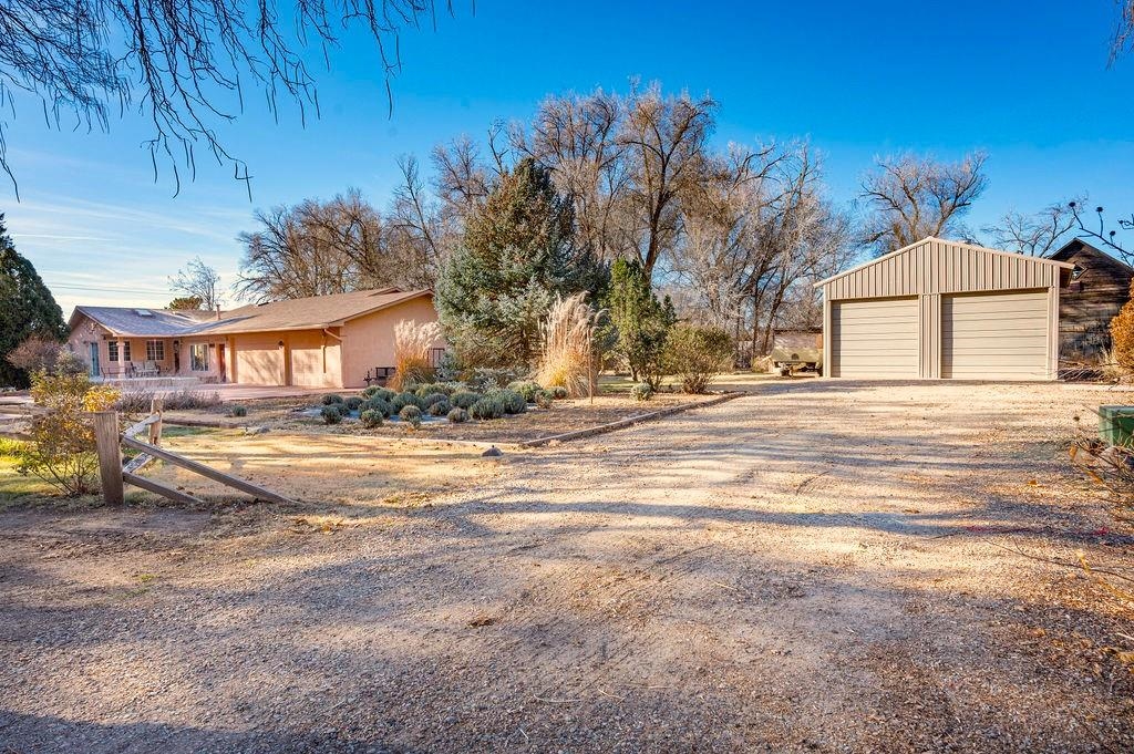 This Peaceful Palisade ranch home sits on ¾ acre and has all the PLUSES! A wonderful home featuring 4 bedrooms PLUS and Office, PLUS a separate Family Room, PLUS and attached shop, PLUS a second detached Shop/garage. (In addition to the attached 3-car garage). All on a quiet tree-lined street with beautiful mature landscaping. The kitchen includes granite counters with plenty of cabinets and counter space, PLUS a cozy breakfast nook surrounded by windows with direct access to the shaded, east facing patio. An oversized 3-car attached garage features an array of built-in storage cabinets and a heated dream shop with air compressor lines for tools. A second detached shop includes a walk-in cooler (great for hunters or fruit) and plenty of room for RVs, boats or toys. All information, including measurements & SF, should be verified by buyer.