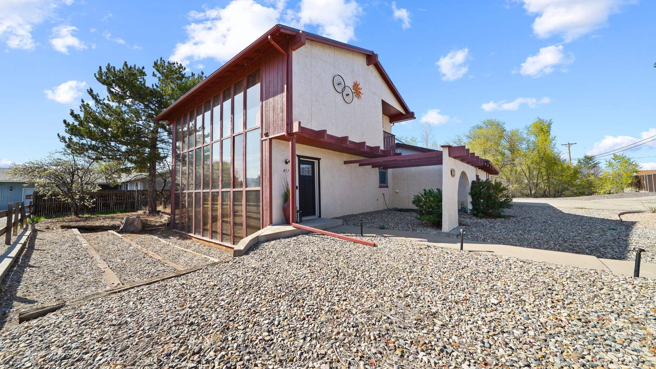 This beautifully updated unique passive solar home located just North of downtown Fruita is a must see.  The passive solar setup has insulated shutters and heat extraction fans to help cut your high heating costs!  Updates include nearly new roof, roof mount air/furnace unit, cooling/heating spit on main floor, stainless steel appliances, hot water heater, farm sink in kitchen, granite countertops, updated bathroom and newer Anderson windows and doors.  This two story home with walk out basement backs to a seasonal creek to provide lots of privacy and space. Home appraised for $525,000 in April of 2022.  Not a drive bye, must get inside!