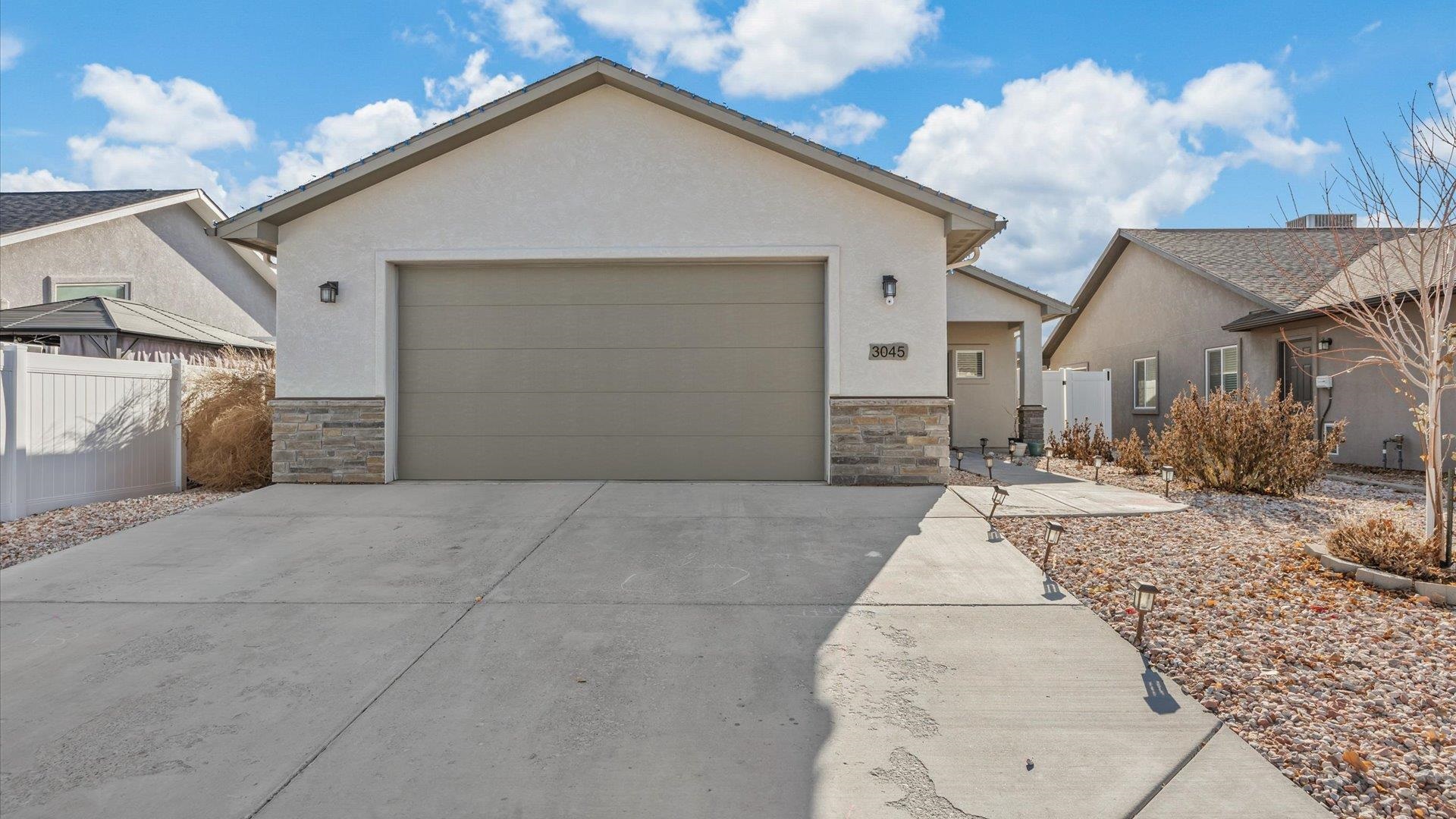 Discover this inviting 3-bedroom, 2-bathroom ranch-style home in the highly sought-after Pear Meadows subdivision. Built in 2018, this property blends modern convenience with thoughtful design, creating the perfect space for relaxation and entertaining.  As you step inside, you'll be greeted by vaulted ceilings and an open-concept layout that allows natural light to flow seamlessly through the living, dining, and kitchen areas. The kitchen is designed for functionality and style, featuring a spacious pantry, modern appliances, and plenty of counter space for meal prep or hosting gatherings.  The split-bedroom floor plan provides privacy and comfort, with the primary suite offering a walk-in closet and a luxurious 4-piece en-suite bath. Two additional bedrooms share a well-appointed bathroom, making this home perfect for families or guests.  Outside, there is a low-maintenance xeriscaped yard which is fully fenced for privacy. Enjoy the covered patio, ideal for outdoor dining or unwinding at the end of the day. The backyard offers plenty of room for play, gardening, or simply relaxing in the Colorado sunshine.  Located close to 30 Road and D ½ Road, this home is within a short distance to Pear Park Elementary and a short ride to the River Trail for Las Colonias events, parks, and amenities. This move-in-ready home offers a great location, modern features, and a layout you'll love.