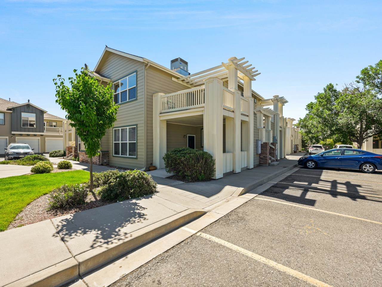 Welcome to this delightful, upper level two-bedroom condo located in the north area of Grand Junction, CO! As you enter the condo, you'll immediately notice the spacious and open living/dining areas, which boasts plenty of natural light and high ceilings that create a bright and welcoming atmosphere. The large, bright kitchen is open to the living space, making entertaining easy, and has a pantry for additional storage. You’ll find the two generously sized bedrooms are perfect for relaxation and rest. The primary bedroom has a walk-in closet and a three quarter en-suite bath, while the secondary bedroom has access to the full bath in the hall. Step outside onto your large deck with a beautiful pergola and enjoy the stunning Colorado weather while admiring the mature trees and walking paths that are HOA maintained. The exterior of the condo is also HOA maintained, ensuring a pristine look and feel for years to come. The one-car garage is accessible by a staircase off the dining area, perfect for parking and easy access. You'll be pleased with the parking lot that is available for extra vehicles and visitors. Additionally, you'll appreciate the convenience of living close to shopping, dining, and schools, as well as being just a short drive away from downtown, St. Mary's Hospital, and Colorado Mesa University. Updates include new LVP flooring! This stunning two-bedroom condo is the perfect place to call home in Western Colorado. Don't miss out on this opportunity to live in a beautiful and convenient location, where you can relax and enjoy all the amenities that this condo has to offer!