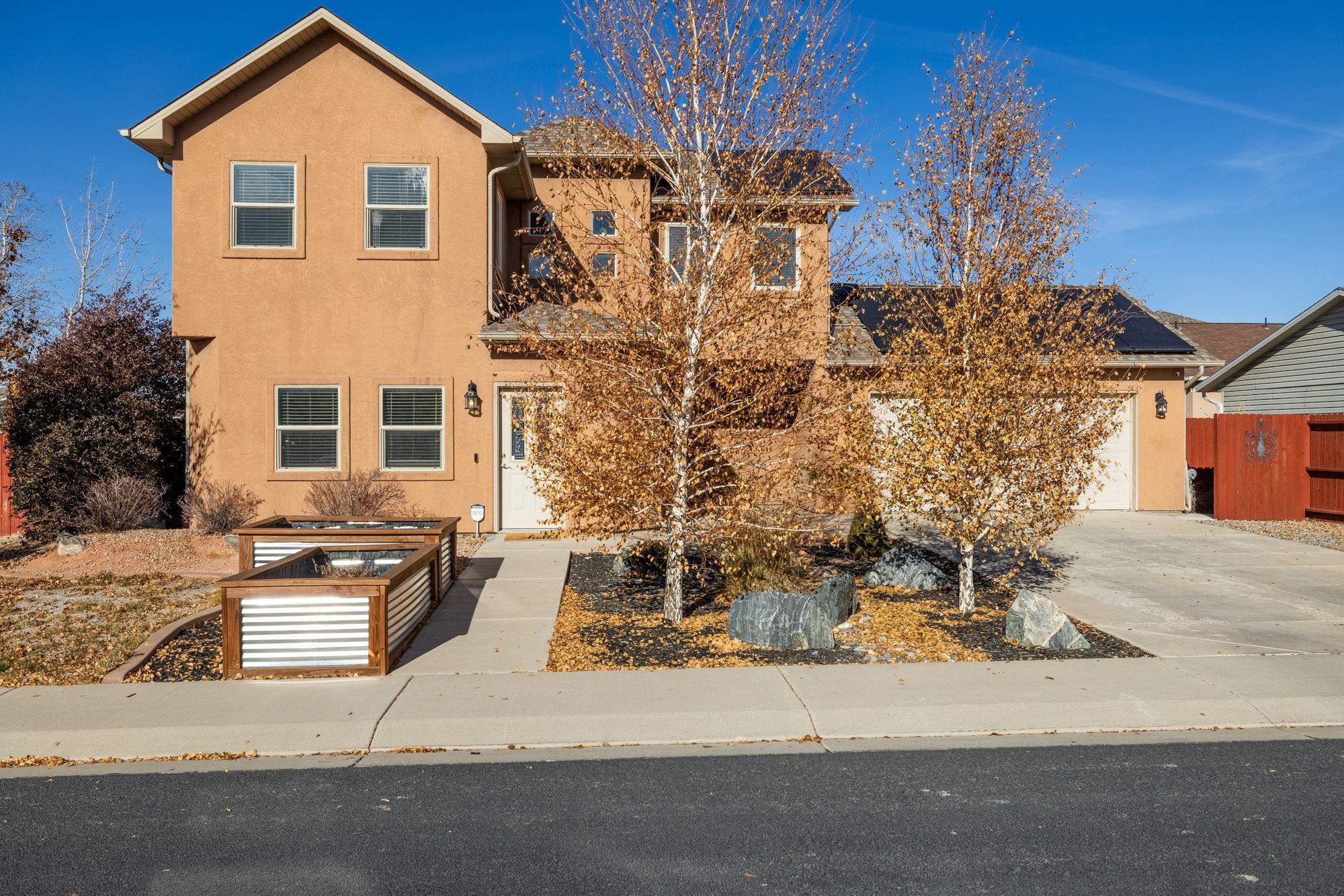 This charming corner-lot property is nestled in the sought-after SE area of Grand Junction, this gem boasts an ideal location in a welcoming neighborhood. With 3 spacious bedrooms, 3 bathrooms, and a variety of tasteful updates, this home is a perfect fit for families and buyers seeking comfort, style, and functionality! The main level offers a seamless flow between the living room, kitchen, and dining area, creating a warm and inviting space for everyday living and entertaining. Upstairs, you’ll find a cozy primary suite featuring modern updates, an ensuite bathroom, and plenty of natural light. Two additional bedrooms and another full bathroom provide the perfect setup for guests, kids, or a home office. Step outside to your private oasis! The fully revamped landscaping features raised garden beds, ideal for the green thumb in your life, and a spacious yard perfect for entertaining, summer BBQs, or simply relaxing under the stars. With its unbeatable combination of location, upgrades, and potential, this home truly has it all. Schedule your showing today and make it yours!