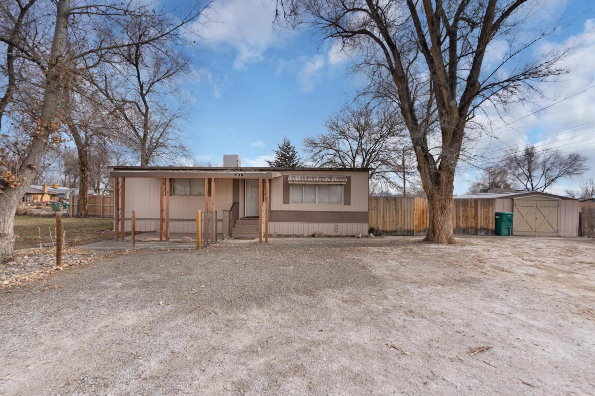 Charming 2-Bedroom, 2-Bathroom Pre-HUD Manufactured Home in Fruita, CO Welcome to 312 S Cedar St, Fruita, CO, where affordability meets opportunity! This well-maintained pre-HUD manufactured home offers a comfortable 2-bedroom, 2-bathroom layout situated on a generous 0.28-acre lot. Whether you're a first-time buyer, investor, or downsizing, this property delivers space, functionality, and convenience. Spacious Lot with Irrigation Water Enjoy the perks of a large yard, perfect for gardening, outdoor entertaining, or simply taking in the serene surroundings. The property includes irrigation water, making it easy to maintain lush landscaping or grow your dream garden. The expansive lot also offers room for expansion or customization to fit your lifestyle. RV Parking and More Need extra space for your RV, boat, or recreational toys? Look no further! This home boasts ample RV parking, ensuring you have room for all your adventures. With Fruita's vibrant outdoor recreation scene, you'll appreciate the easy access to nearby trails, parks, and national monuments. Comfortable Interior The home’s interior features a functional floor plan with a cozy living room, efficient kitchen, and designated dining area. The two bedrooms are well-sized, and the two full bathrooms add convenience for residents and guests. While the home retains its vintage charm, there’s plenty of potential for modern updates to make it uniquely yours. Convenient Location Situated in the heart of Fruita, you’ll enjoy close proximity to local schools, shops, dining, and community events. The friendly small-town vibe combined with easy access to Grand Junction and I-70 makes this property an excellent choice for those seeking a balance of tranquility and convenience. Investment Potential With its desirable location, large lot, and unique features, this property is an excellent opportunity for investors looking for a rental or long-term appreciation in the thriving Fruita market. Don’t miss your chance to own this versatile property that offers endless possibilities. Schedule your showing today and start imagining the potential of 312 S Cedar St!