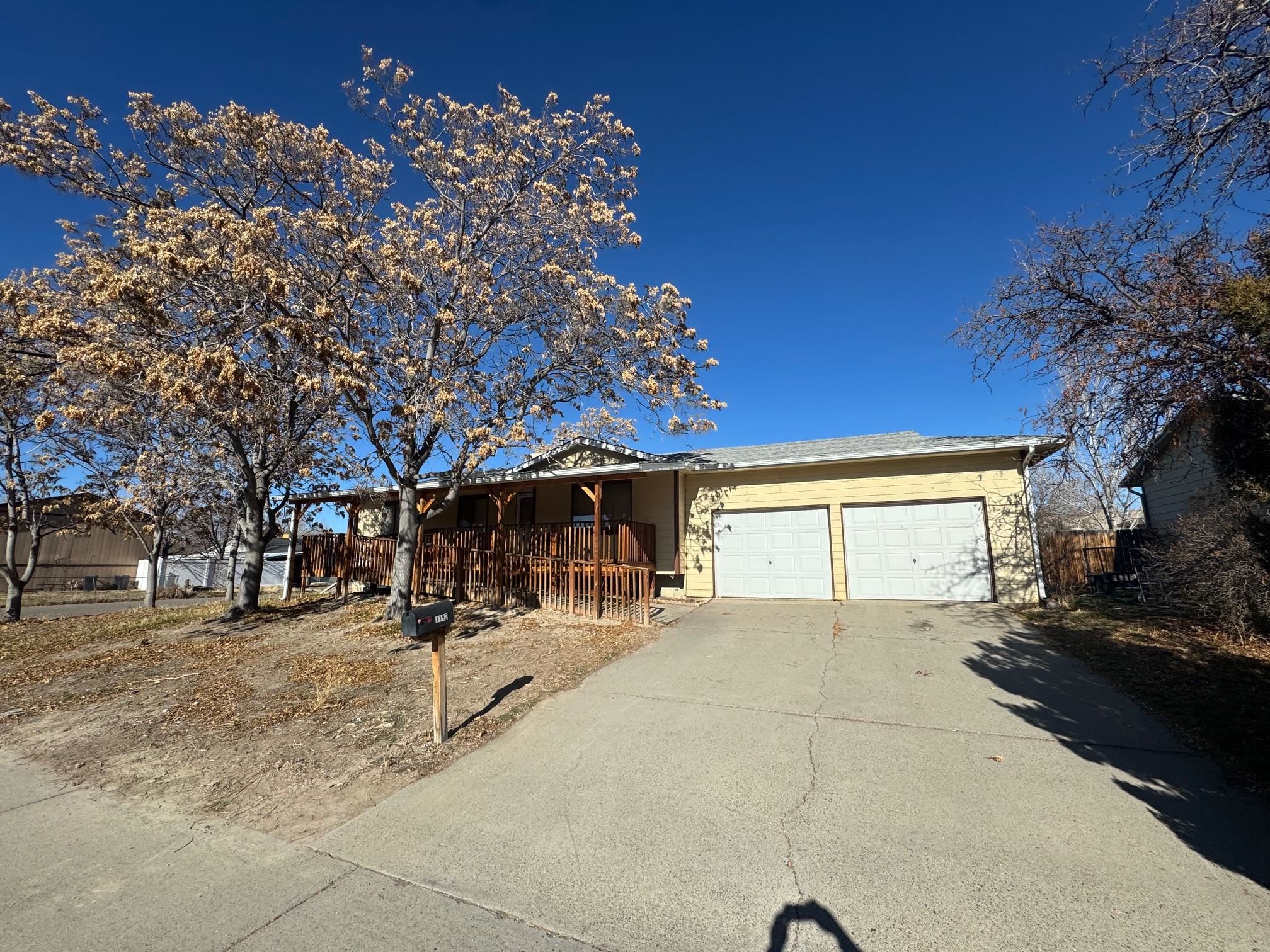 NOW PRICED @ Only $143 per ft. this is a STEAL!!! Expansive home with three bedrooms, 1 bath, 1948 Sq. Ft. with nice attached two car garage and lovely corner lot in the North East Area! This home has a perfect layout with three bedrooms on the main level with spacious living room and kitchen area. The lower level is a huge space with tremendous potential, the lower unfinished basement is heated and cooled with electrical and plumbing is roughed in for a secondary bathroom as well as insulation...just needs some drywall, paint and flooring. There is also enough new carpet in the downstairs to cover the entire upstairs and is included! This home also has all appliances included with refrigerator, dishwasher, electric range oven, range hood and washed & dryer also. Newer Roof replaced only 5 years ago, newer exterior deck updated only 5 years ago with wheelchair ramp access, newer garage doors replaced only 5 years ago. There is also a commercial grade evaporative cooler, updated heating system and all systems ready to go. This home has amazing potential, needs TLC and has been priced to sell as is with great opportunity to expand and make this home amazing!