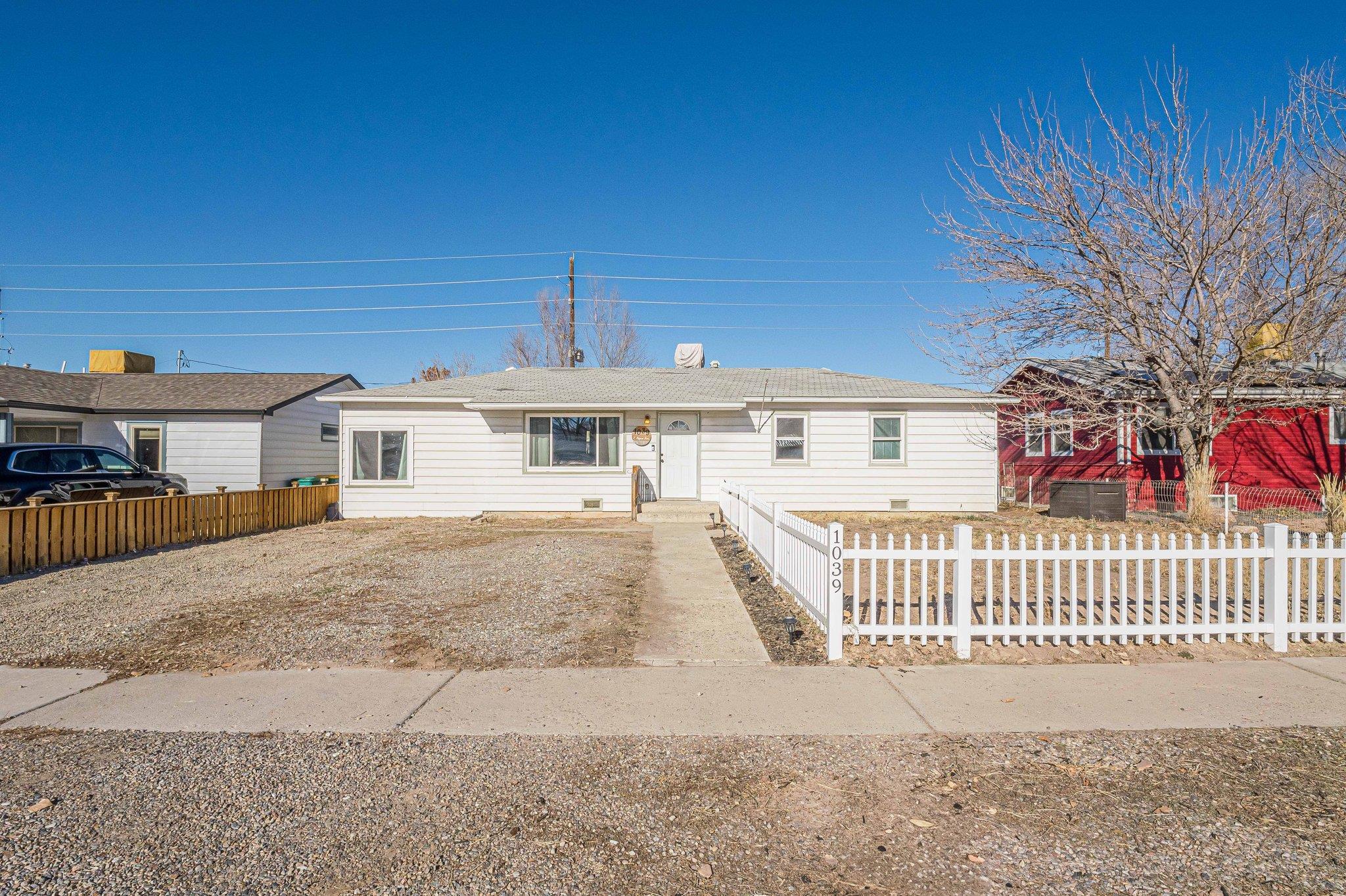 Discover this cozy 3 bedroom, 1 bathroom home that is perfectly situated for outdoor enthusiasts.  This property offers convenient access to nearby trails, hiking and biking and all of the downtown Fruita activities.  Inside you will find a welcoming layout with plenty of natural light. The living area features original hardwood flooring and is perfect for entertaining or relaxing.  The newly updated kitchen boasts new cabinets and beautiful granite countertops.  The kitchen flows into a family room that could be used as an office, playroom or non-conforming 4th bedroom.  Additional updates include all new energy efficient windows with a 45 year warranty. The backyard has an enclosed dog run, a storage shed and alley access.  The rest is a blank slate, offering endless possibilities to create your perfect outdoor oasis.  Whether you envision a large garden, play area, entertainment space or ADU, this yard is ready to bring your vision to life.