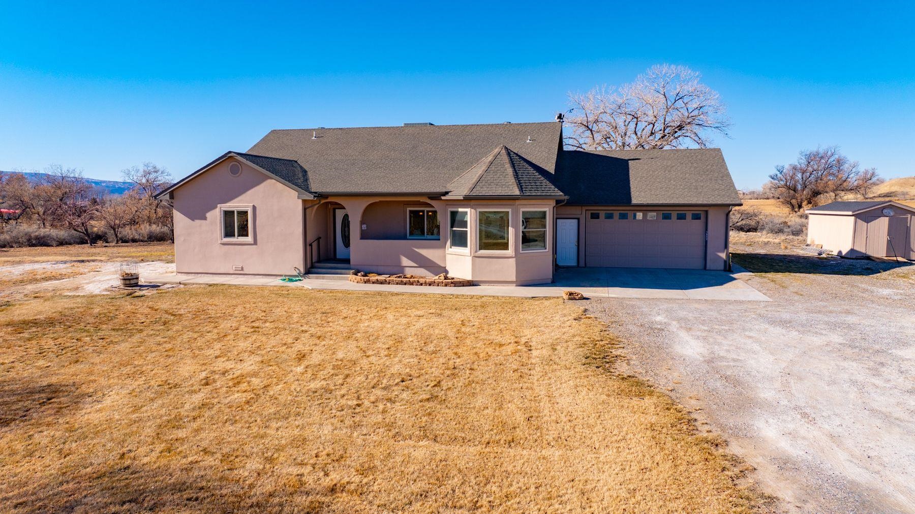 Charming 3 bedroom, 2 bathroom home on 5+ acres - Perfect for country living. Escape to the tranquility of country living with this well-maintained 3 bedroom, 2 bathroom home set on over 5 acres of picturesque land.  Offering a spacious, thoughtfully designed layout, this home features generous living areas, an updated kitchen, and plenty of room for growing families or those seeking extra space. The interior boasts large bedrooms, ample closet space, and a cozy yet open living area that invites relaxation.  With a two-car garage and plenty of extra storage, there's room for all your vehicles, tools, and outdoor equipment.  The property is a blank slate for outdoor enthusiasts, with 5+ acres of gently rolling land, perfect for gardening, farming, or simply enjoying wide-open spaces. Whether you're looking to build your dream outdoor space, raise animals, or just enjoy the peace and privacy of country life, this home provides the foundation to do it all.  Don't miss your chance to own this beautifully cared-for property with endless possibilities. This is the home you've been waiting for - schedule a tour today and envious your future in this serene, rural retreat!