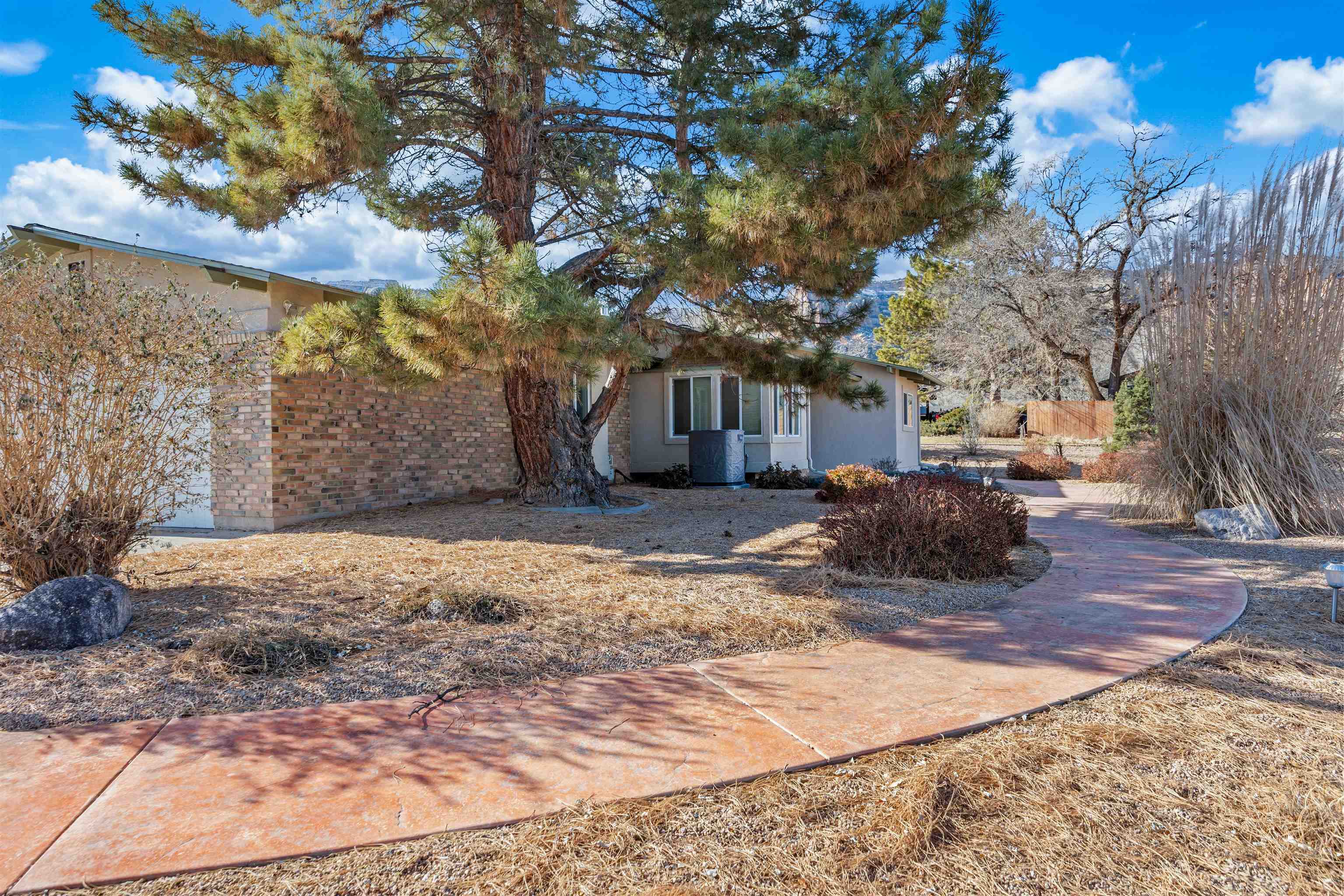 Charming Golf Course Retreat  Location: Nestled on the scenic third hole of Tiara Rado Golf Course   Step into your own slice of paradise in this delightful three-bedroom, two-bathroom home, where the beauty of Colorado’s natural landscape meets the joy of golf course living. Built in 1972, this charming residence exudes character and warmth, offering a spacious 1,483 square feet of thoughtfully designed living space.  As you enter, you’ll be greeted by an inviting living area bathed in natural light, perfect for both relaxation and entertaining. The kitchen flows seamlessly into the dining area, providing a cozy space for family meals and gatherings. Each bedroom is generously sized, offering comfort and privacy, making it ideal for families or guests.  Step outside to your private oasis, where breathtaking views of the Colorado National Monument surround you. Enjoy your morning coffee on the patio while soaking in the serene beauty of nature or unwind after a day on the links with a sunset dinner overlooking the lush greens of the golf course. Included is a brand new Dry Sauna. Sit in it and whisk away all the aches and pains.  Whether you’re a passionate golfer or simply seeking a peaceful retreat, this home is your gateway to an active lifestyle and a vibrant community. Don’t miss the opportunity to make this enchanting property your own!