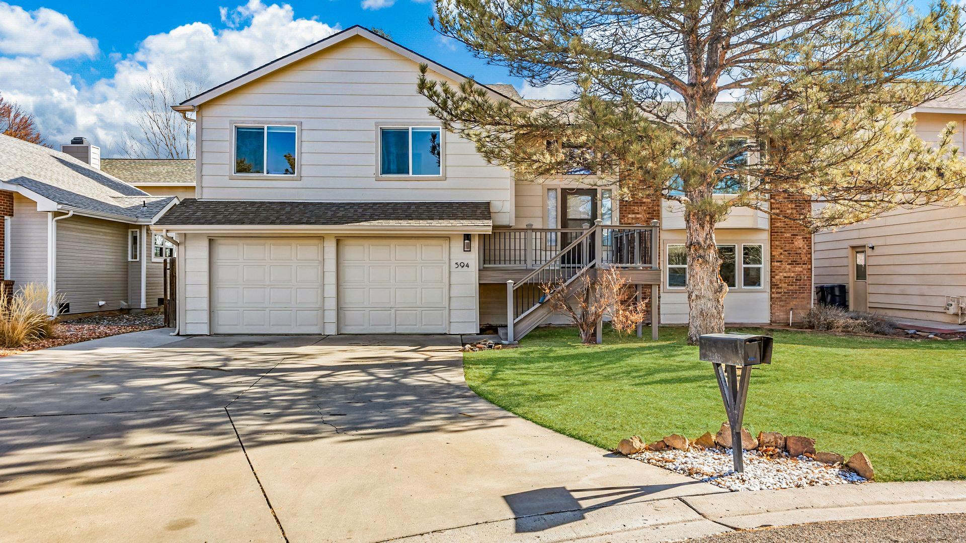 This Redlands home is located in a quiet cul-de-sac, offering stunning monument views from the front yard and picturesque Grand Mesa views from the back deck. The kitchen, remodeled in 2020, features new cabinetry, granite countertops, stainless steel appliances, and a convenient kitchen island. Additional upgrades include new carpet throughout Feb 2025, a new water heater installed in 2024, exterior paint completed in 2023, dual-pane windows, composite siding, and weather-resistant front and back decks and stairs. The furnace was replaced in 2017. The oversized garage, measuring 800 square feet, provides ample space for a small workshop or plenty of extra storage.