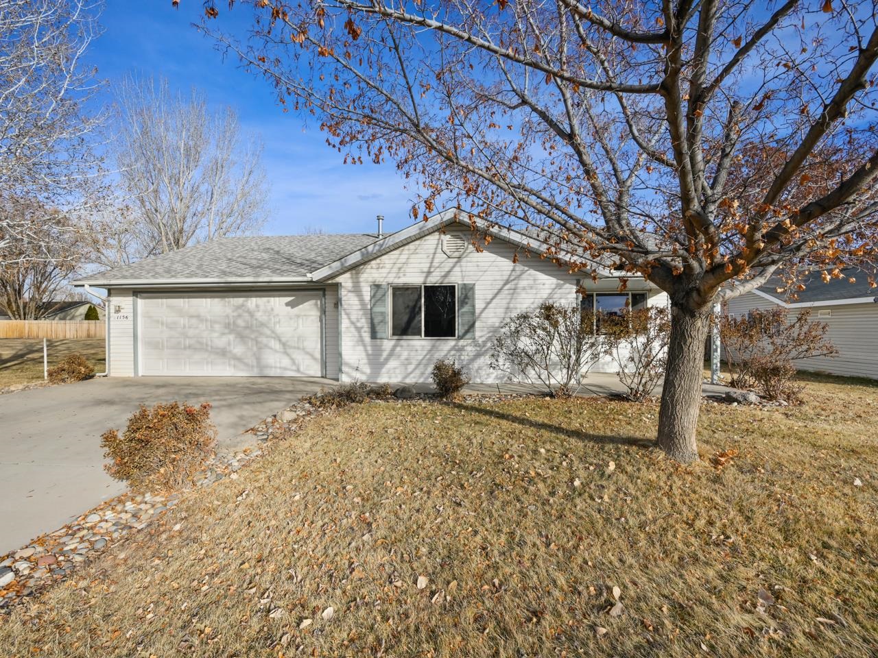 Welcome to this inviting home in Fruita’s Monument Glen subdivision on Locust Street. Enjoy the peace and privacy of no neighbor to the north in this quiet community. Inside, a bright, open living area welcomes you with vaulted ceilings and modern LVP flooring. The kitchen features granite countertops, ample prep space, and a sit-up counter for extra dining options. Additionally all appliances were replaced in 2019. The primary bedroom offers direct access to a shared four-piece bathroom with a spacious walk-in shower, while two additional bedrooms - one extra-large with backyard access - provide versatile space. Step outside to a large covered patio with misters, perfect for relaxing or entertaining, and a fully landscaped yard with a handy storage shed. Plus you'll have extra peace of mind, knowing the roof was replaced in 2022. Don’t miss your chance to call this bright, peaceful, and spacious home your own. Come see it today!