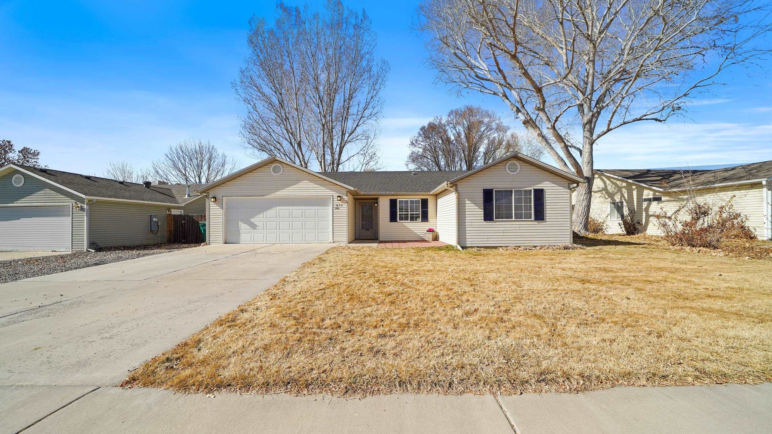 NEW ROOF (2024), NEW HOT WATER HEATER (2025) and continual improvements over the last 10+ years! This one is move-in ready with many big ticket updates completed so you don't have to worry. Boasting one of the larger floor plans in the neighborhood, this charming home has 3 bedrooms PLUS an office, 2 bathrooms, and a heated attached 2 car garage. Open concept living room, kitchen, and dining area with beautiful high quality Pergo luxury vinyl plank flooring, newer baseboards, paint, and trendy light fixtures. Primary suite with 2 closest, and a recently remodeled attached bathroom. One of the biggest perks of this property is the amazing backyard! Automatic sprinkler system and garden boxes keep the landscaping lush, plus a large covered patio perfect for entertaining. Mature trees create a shady haven to enjoy the Colorado outdoors. As if you needed another bonus, this lot backs to the neighborhood open space so there's no neighbor directly behind for additional space and privacy. Perfect for the first-time buyer, investor, or those looking to downsize, this property is sure to fly off the market! Contact your REALTOR for a complete list of updates!