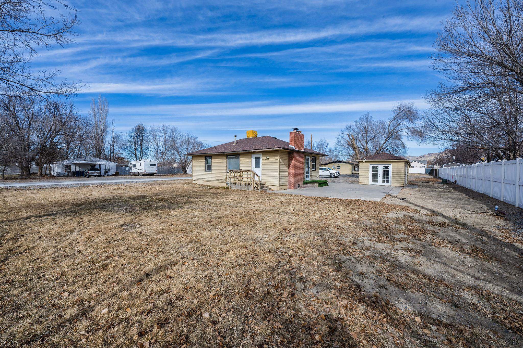 Cute two bed one bath home on .28 of an acre with no HOA. This home has an updated kitchen with black cabinets, quartz countertops and stainless-steel appliances, updated bathroom, vinyl replacement windows, newly painted inside, Oak hardwood floors and an old-style fireplace with a gas insert. Outside you will love the abundance of space and the three-room shed for your projects or storage. If you are looking for a smaller home with lots of room around it, then look no further. All information is subject to error.