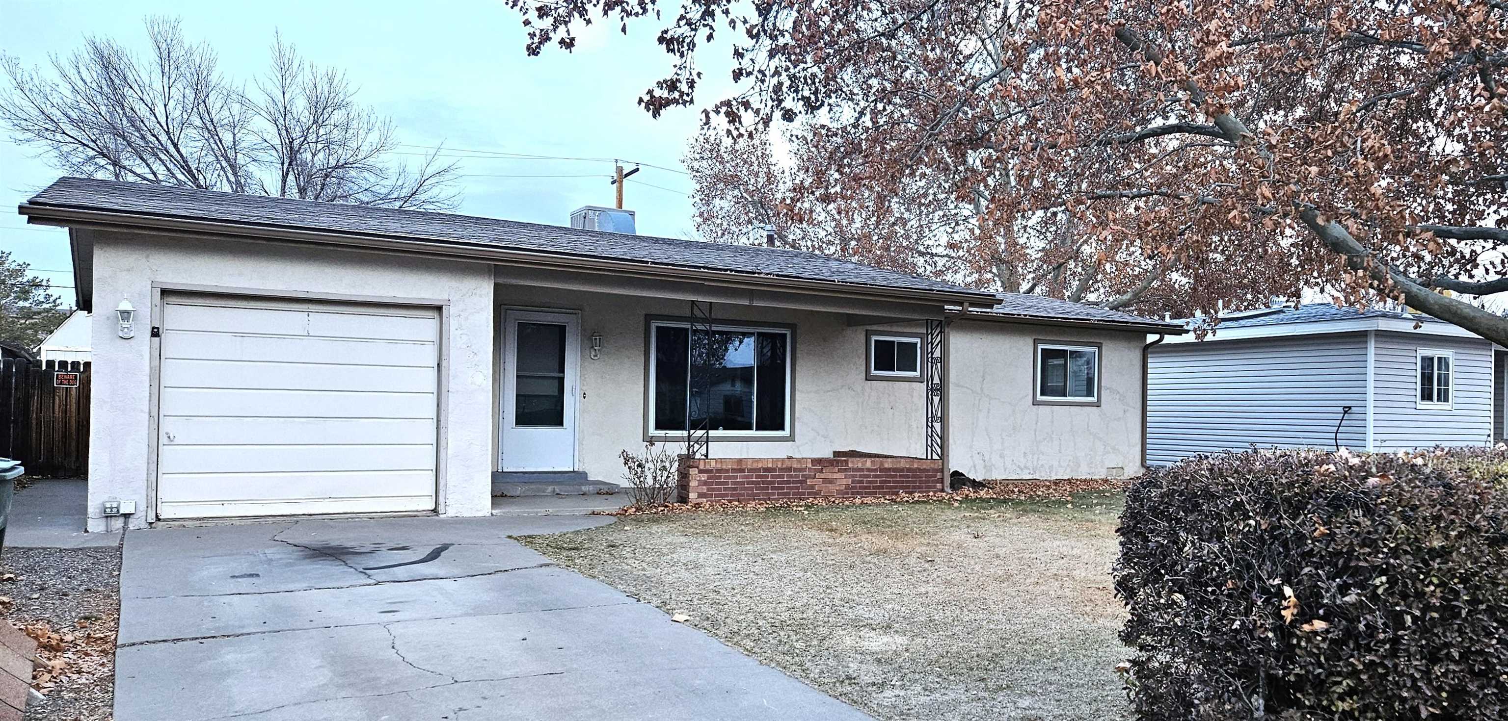 This home is in livable and loanable condition currently.  Great option for someone looking for some sweat equity/fixer as it is dated. The roof, evap. cooler, gutters, water heater, electrical panel, stove and refrigerator, irrigation pump have all been replaced since 2016.  Hardwood floors are in great shape but need finishing. Home is stuccoed and has an attached garage and a storage shed in the backyard.  Would make a good rental or for college students.  All info is subject to error/correction.  Buyer and their broker to verify to their satisfaction.