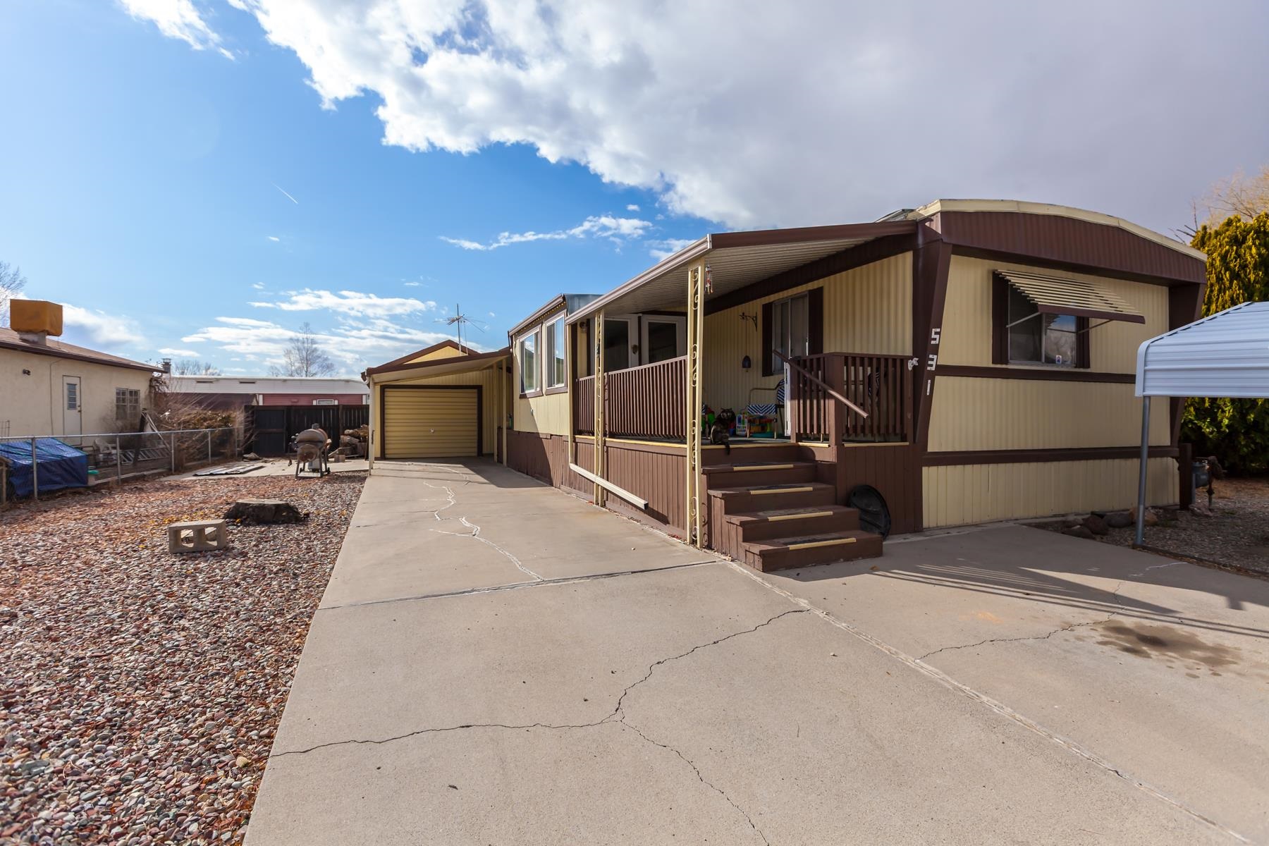 This 3-bedroom, 2-bath manufactured home offers a comfortable split floor plan and a spacious living area with a cozy wood-burning stove. Outside, you’ll find plenty of parking, including a 1-car detached garage, RV space, and covered carports. The yard features peach and apricot trees, plus a great garden area for homegrown produce. Don’t miss this opportunity—schedule your showing today!