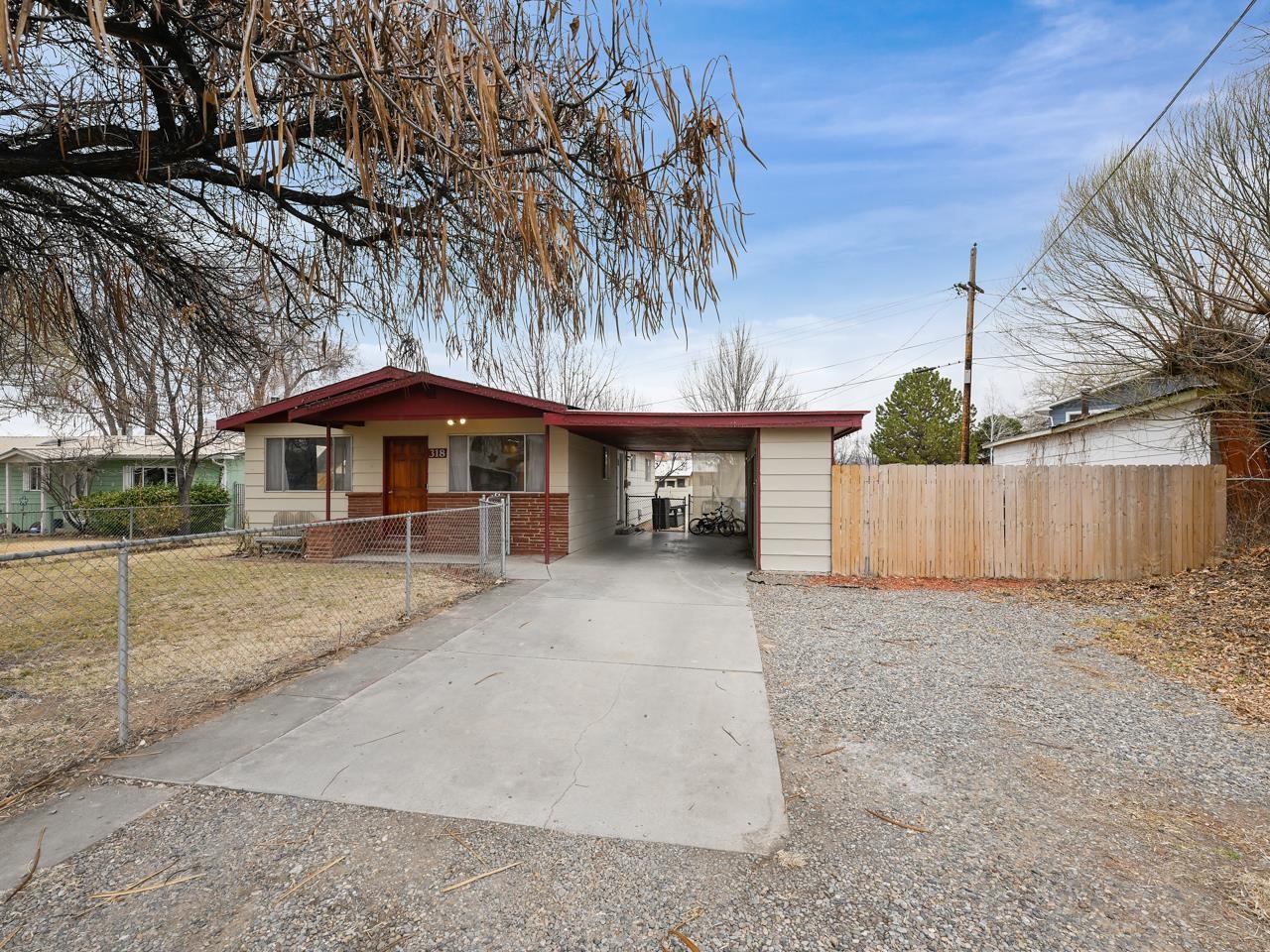 Looking for a house that checks all the boxes and still has room for a little extra fun? Look no further than this well-maintained home on Zuni Drive! With a generous sized lot, this home puts you in the perfect spot - just a short drive from businesses, schools, and the recreational hot spots of both Orchard Mesa and Downtown GJ. When you arrive, you'll be greeted by a large front yard with mature trees that say “Welcome home!” Step inside and be embraced by an open living space with a smooth flow. The kitchen/dining area has a seamless rustic charm, thanks to a pass-through window and flooring that brings a touch of cozy vibes. The three bedrooms await, each one with easy access to the full bathroom and room to spread out your stuff! Need more space? No problem! The backyard comes with irrigation rights and a wide-open canvas for your outdoor dreams - stretch out and enjoy. Storage? You got it! The carport comes with two bonus storage closets, ready to house your extra things. Oh, and for peace of mind, there’s a security system in place. With newer paint and carpet, this home is all about that fresher vibe. And guess what? No HOA means you have the freedom to make this place 100 percent your own. Don’t wait! This charming home is waiting for you. Come see it today and let it steal your heart!