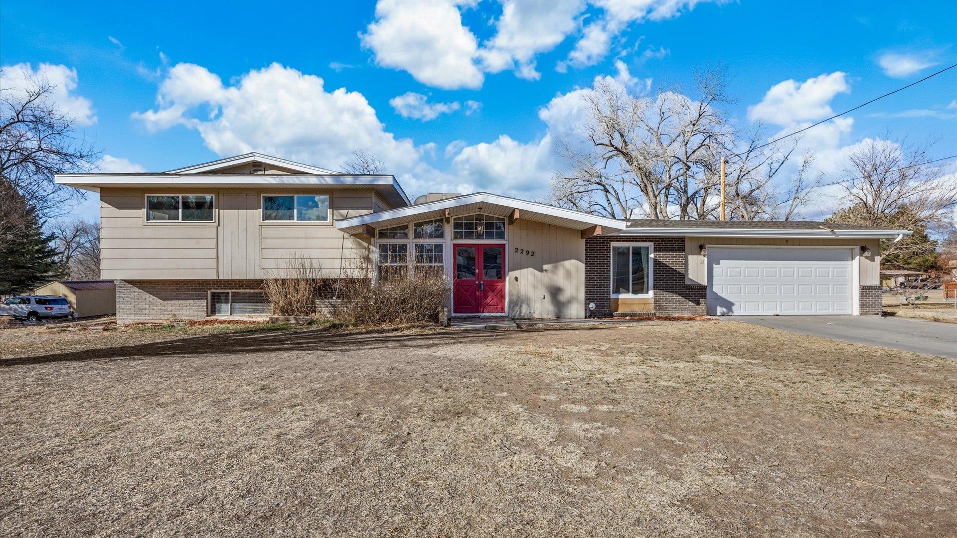Welcome to 2292 Pawnee Drive, a unique property in the highly desirable Redlands area—a spacious 4-bedroom, 3-bath single-family home offering over 2,300 sq ft of living space on 1.5 acres of level ground. This home features a huge deck, hot tub, balcony, playset, and large shed, providing ample outdoor space for relaxing and entertaining. Plus, there's plenty of room for RVs and more!  Inside, you'll find a cozy atmosphere enhanced by two fireplaces, beautiful Spanish tile in the kitchen and dining area, and striking ceiling beams that add character and charm. While this "project" home needs work, it offers incredible potential to become your dream home with the right updates. It’s ready for your personal touch to restore its true value and transform it into a million-dollar property.  Located in a prime spot, this home is convenient to nearby schools, parks, trails, shopping centers, and restaurants. It’s a fantastic opportunity for buyers looking to invest in a property with great bones and limitless possibilities.  With a bit of vision and creativity, you can turn this house into your forever home. Don’t miss out—contact me today for a private tour!
