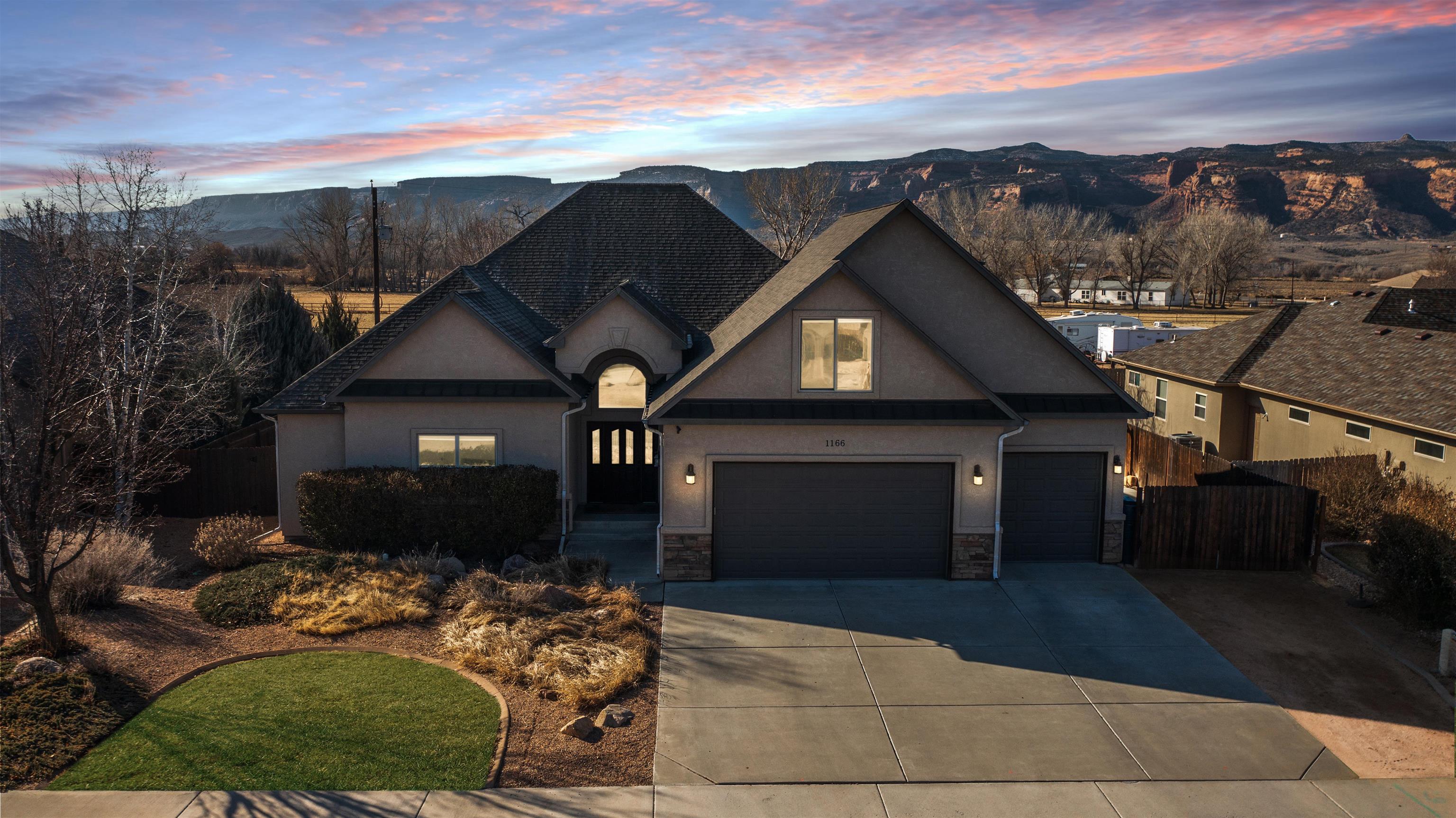 Beautiful custom home w/ AMAZING unobstructed views of Colorado National Monument from back yard & patio! This open floor plan has 3 beds, 2.5 baths, 2700 sq ft of living space & 3 car garage. Wonderful kitchen w/ granite countertops, stainless steel appliances that are all included, walk in pantry & tons of counter space!! HUGE master suite w/ 5 pc bath, walk in closet & access to covered back patio. Upstairs you will find a large bonus room that would make a great kids retreat or office. Mature landscape in the back yard w/ open & covered patios, RV Parking & fully fenced. Easy access to shopping, restaurants & I-70.