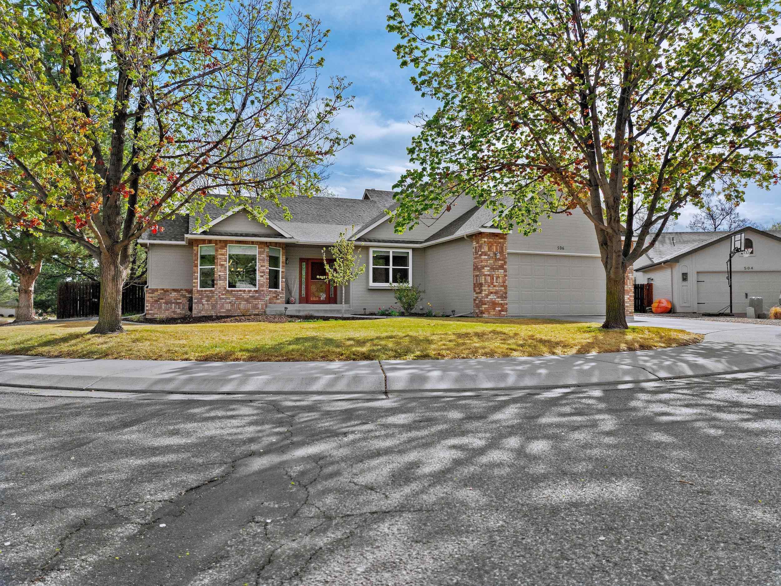 Sophisticated Living in the Heart of the Redlands. Nestled at the end of a quiet cul-de-sac in one of Grand Junction’s most desirable neighborhoods, South Rim Subdivision. This beautifully updated home offers comfort, elegance, and peace of mind. With three spacious bedrooms, three bathrooms, a dedicated home office, a walk-out basement, and a two-car garage, this stunning, natural-light-filled residence is designed for functionality and refined living. Step inside to discover an open floor plan and completely remodeled kitchen featuring newer appliances, modern cabinetry, and stylish finishes—perfect for entertaining or everyday living. The open dining area flows seamlessly onto a gorgeous deck, ideal for morning coffee or evening gatherings under the Colorado sky. The walkout basement includes a bright and inviting living space, perfect for a second family room, rec room, or home gym.  With updated carpet, flooring, windows, window coverings, interior and exterior paint, and thoughtful upgrades throughout, every detail has been taken care of so you can move right in and enjoy. The home has been lightly lived in and meticulously maintained, which becomes clear the moment you step through the front door. Ideally located just minutes from premier recreation areas, including Connected Lakes, Lunch Loop trail systems, and the Colorado National Monument. Don’t miss this opportunity to own a truly turnkey home in the Redlands—where serenity, style, and smart updates come together beautifully. See it today!