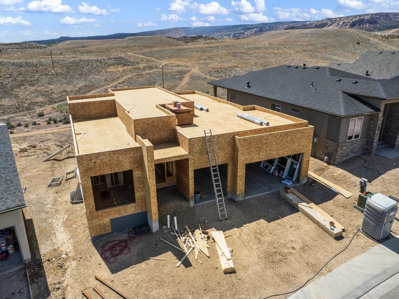 We are thrilled to announce another beautiful build by Goetzmann Custom Homes, an award-winning builder with over 35 years of experience. Come visit our model home in the Easter Hill community of Redlands 360. This particular home is under construction, and is perched on a bench, offering views of the beautiful surrounding areas. The home includes a 3 car garage. There are BREATHTAKING views from the deck/patio. Additionally there is a finished walkout basement with 9’ ceilings. Also included is a gas line for grill, High SEER A/C unit, whole house fan, upgraded kitchen quartz countertop, kitchen island, finished Optional wet bar. Enjoy the electric fireplace in Great room & fireplace in rec room. Additionally the home has pre-plumb for the optional 1/2 bath in the basement. The neighborhood, Redlands 360,  encompasses more than 600 acres and will feature open space and a variety of trial systems. Literally, the trail system is just footsteps out the backdoor. Ready for your next mountain bike adventure, hiking excursion or simply taking your dog out for a quick walk? You can not beat this location for enjoying the vast terrain and stunning views.  Beautiful open concept, offers phenomenal views of Easter Hill and the stunning National Monument. Builder is offering a $15,000 Landscape Incentive. Contact listing agent for details on other available lots and homes in this neighborhood, and visit our model home just down the street from this location.