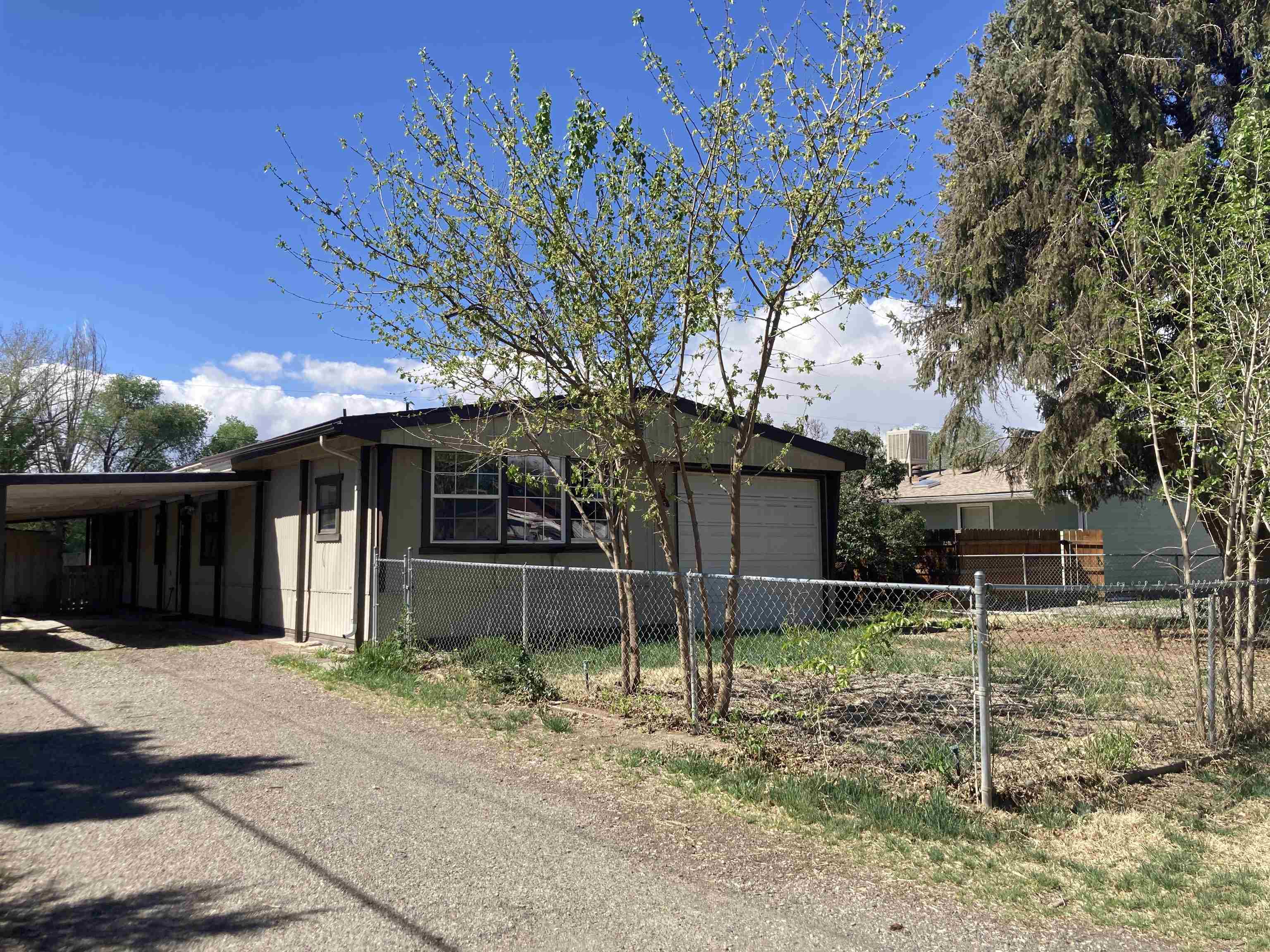 Affordable move in ready manufactured home with attached garage on a large lot. This home has new carpet and plenty of storage inside and outside in multiple storage units. The property also has a cellar for additional storage.  Schedule your visit today!
