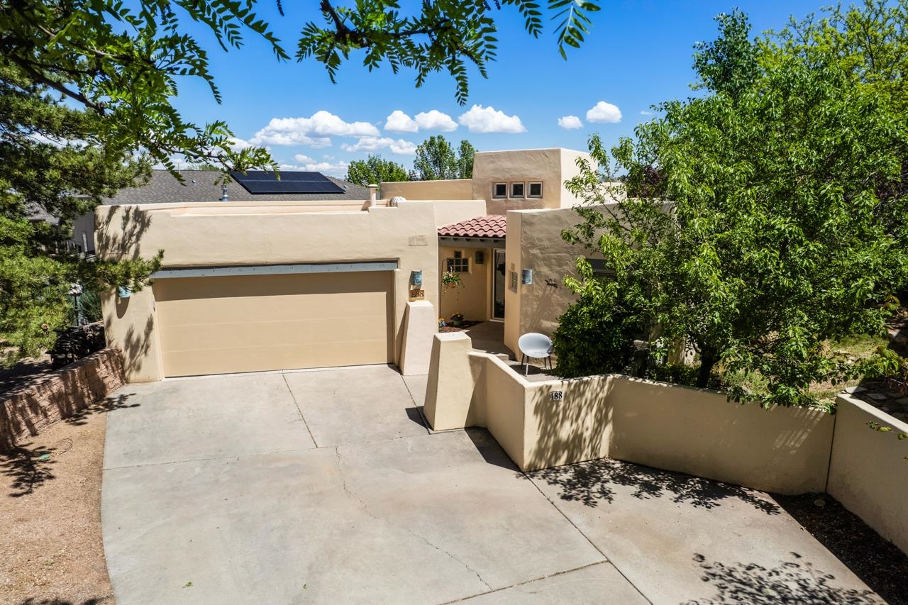 Welcome to your dream home in the coveted Seasons neighborhood in the Redlands! Nestled near the stunning Colorado National Monument, Tiara Rado Golf Course and the Kindred Reserve Open Space Park, this exceptional home defines easy living and an enviable lifestyle. Enter the inviting foyer, where you'll be greeted by abundant natural light and soaring 10-foot ceilings. The open-concept layout seamlessly connects the living, dining, and kitchen areas, making it perfect for entertaining. The kitchen boasts elegant granite countertops, modern appliances, a stylish dry bar, and a bar top that can comfortably seat six. The spacious living and dining areas, adorned with beautiful white oak hardwood floors and a cozy gas log fireplace, provide the ideal setting for gatherings or quiet evenings at home. If you're needing some fresh air, an attached pergola covers a tranquil and private patio, allowing you to unwind after a day of exploring nearby recreational opportunities. This home features a generous primary suite complete with a walk-in closet and a luxurious en-suite bathroom, along with an additional bedroom and guest bathroom to accommodate visitors. Recent upgrades include new Andersen windows, Hunter Douglas blinds, hardwood floors and a new roof, all completed in 2022. Situated just minutes from outdoor recreation and a wealth of amenities, this is the perfect place to call home. Don't miss out on the opportunity to make it your own!
