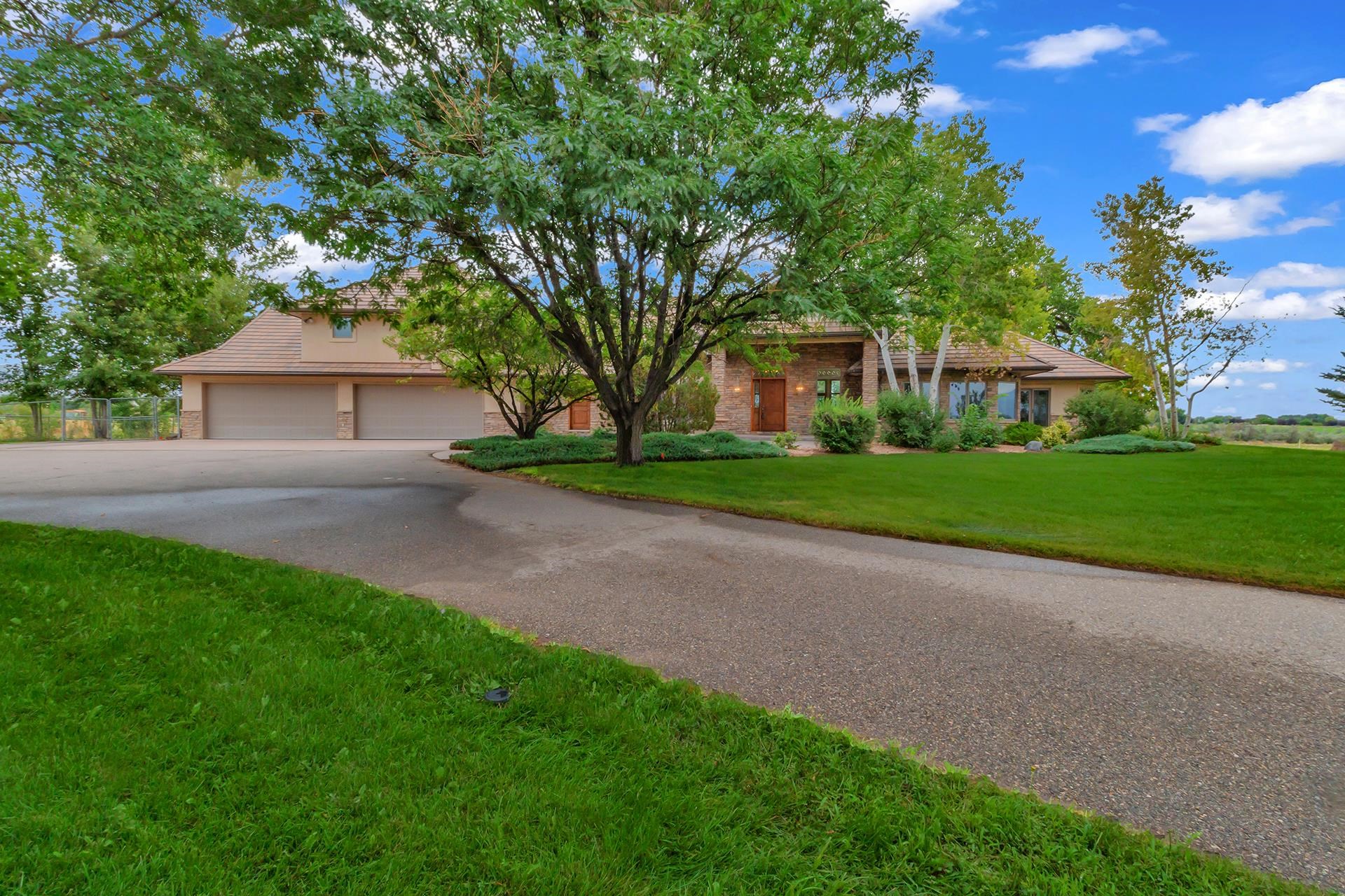 Introducing this beautiful home in one of Grand Junction's new prestigious subdivision, with a total of 14 estate living lots called Cochran Wash Preserve, with unparalleled views encompassing the 70+ acres. this original home overlooks a picture book setting of stately mature trees, lush lawn, flowering shrubs, and endless tranquility. The original oak floors have all been beautifully restored throughout the main level, adding the warmth of the wood to the formal dining room with step up coffered ceilings, the amazing library with a full wall of built in cabinets, the entertainment size living room to the welcoming, kitchen featuring brand new granite counters, Viking cooktop plus Viking range hood, double ovens and microwave, not to mention a large eating area with 9 windows capturing the views of the Bookcliffs and Mesa. Attached to the kitchen is the Arizona room that is glassed and screened - perfect setting for a quiet afternoon of reading. Master suite is on the main floor with 2 extra large bedrooms up and on in the lower level. Lower level also has an exercise room equipped with mirrors and a large family room with a walk-out to endless outdoor possibilities and so much more. See for yourself.