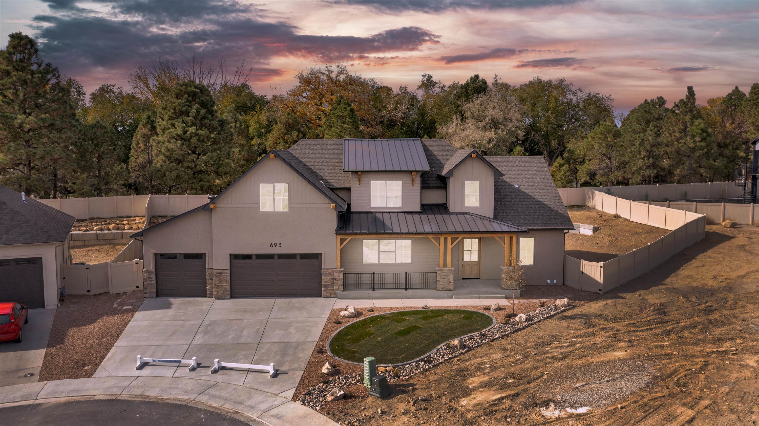 This home is designed for generous space, flexibility, and entertaining. Get a front porch swing and relax while you enjoy the view and the Mesa. Once you enter the 20' towering foyer of this 2 story, you will see the stunning staircase that leads to 2 large bedrooms with walk-in closets and a family room big enough for any occasion. Downstairs has a "dream" kitchen with a 48" gas/range oven with large range hood and built in pop filler, plus all the other appliances by Zline which are elegantly appointed. Amazing pantry with built in cabinets and island bar make the kitchen a perfectly designed kitchen. 14' tray ceiling in living room with stone gas fireplace to the ceiling and large picture windows that look in the neighboring forest of trees. Master suite with stand alone tub, walk-in shower and closet. Large 0.27 acre lot, fully fenced, with front yard landscaping - room for a pool in back plus a special 3rd overhead door from the back of garage for easy access for "whatever". It's special and can be yours!