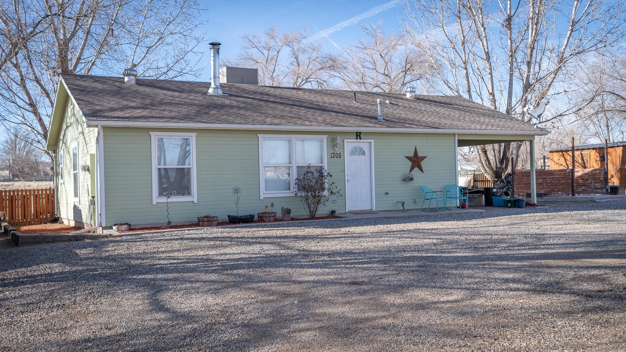 Discover the perfect blend of coziness and functionality in this charming 936-square-foot home with a thoughtfully designed layout. Despite its smaller footprint, this gem maximizes space, providing a warm and inviting atmosphere.Situated on a parcel just under an acre, this property is a haven for horse enthusiasts. The inclusion of a 3-stall barn, a well-maintained 120 x 96 arena, and a convenient shed with firewood storage makes it a dream for equestrians seeking a cozy retreat for both themselves and their horses. Step inside, and you'll be greeted by a home that has been meticulously cared for. Every corner exudes pride of ownership, and the excellent condition of the residence reflects the dedication to maintenance and care. This property not only offers a comfortable living space but also caters to the outdoor lifestyle you've been dreaming of. Whether you're enjoying the tranquility of the barn, practicing in the arena, or simply relaxing in the well-kept surroundings, this home is a sanctuary for those who appreciate the perfect balance of comfort and country living.Don't miss the opportunity to make this unique property your own. Schedule a viewing today and experience firsthand the charm and practicality that this home and its horse-friendly amenities have to offer! Sellers are will transfer 1 share is Loma Lateral irrigation with the sale.