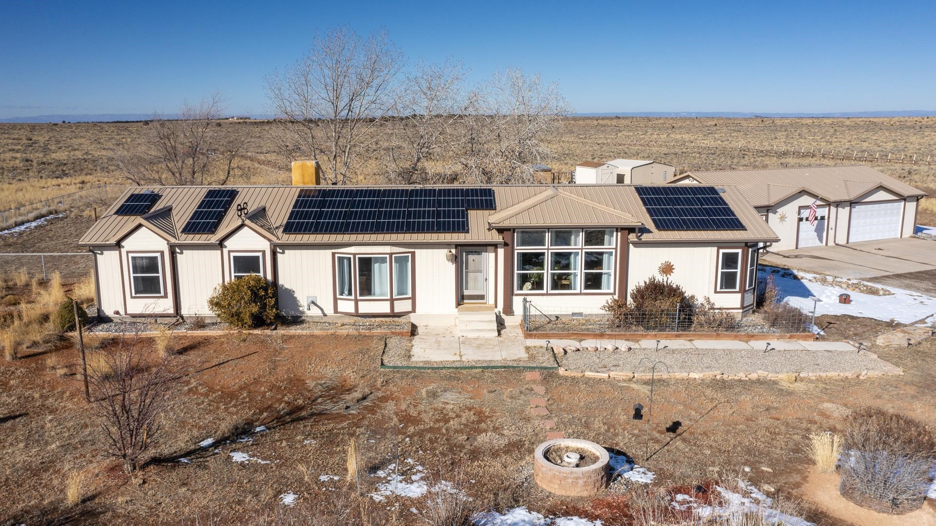 Here is your opportunity to have your own " Homestead" on Glade Park. 38.41 acres, 4 bedroom, 2 bath home ( 1946 sq.ft.) Owned Solar System ( $65,000.00) just installed last year with battery backup. Power goes out, no problem the critical load panel will run the water pump, septic pump, refrigerator + the extra freezer seller had in the kitchen, living room lights, TV and master bedroom outlets. It is also set up to run the battery backup system during the peak hours from 4pm to 9pm ( higher priced) electricity saving you from paying a higher price during those times. Home has central air ( there is also a swamp cooler they never used) 2 propane tanks ( owned). Great floorplan with large windows, skylights, living and family room and Studio/Exercise room 600+ sq. ft. insulated, heated and cooled in the garage. Ultimate game room! Covered patio for outdoor entertaining with access from the kitchen, makes outdoor entertaining easy. Multiple outbuildings, chicken coop, wood shed you will have plenty of room for all your stuff. Pistol and rifle shooting range as well. Home Warranty included.
