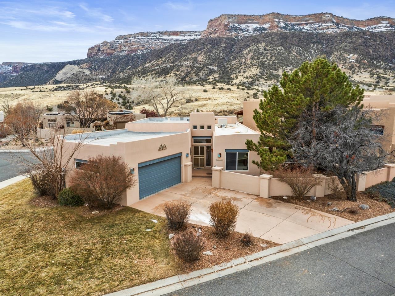 Welcome to your dream home in The Seasons neighborhood of the picturesque Redlands area in Grand Junction, CO! This beautiful 3-bed, 2-bath residence offers a perfect blend of comfort, style, and breathtaking views of the Colorado National Monument. As you step inside, you are greeted by an open living space featuring high ceilings and an abundance of natural light. The cozy gas fireplace sets the mood, creating a warm and inviting atmosphere. The dining area seamlessly connects to the rest of the living space, and a breakfast bar is an additional convenience in the beautifully updated kitchen. A flex space adds versatility to the layout, with the ability to serve as a play area, formal dining room, office space, sitting area, or any other option to meet your needs. The primary suite is a sanctuary of openness and airiness, with a large walk-in closet and a 5-piece en-suite bath. The additional two rooms are generously sized and share a full bath in the hall, with one room providing convenient access to the covered side patio. Step outside onto the open back patio, where you'll find ample space for entertaining, grilling, and soaking in the panoramic views under the red cliffs of the Monument. The surroundings offer a wealth of outdoor activities, including hiking, biking, and climbing. Golf enthusiasts will appreciate the proximity to the Tiara Rado Golf Course just up the road. Convenience is key, with schools, parks, shopping, and the charming Two Rivers Winery nearby. Plus, it's just a short drive to Grand Junction or Fruita for a variety of entertainment options. Whether you seek adventure in the great outdoors or prefer a relaxing evening at home, this property caters to all your lifestyle needs. Don't miss the opportunity to make this incredible home your own and experience the best of Western Colorado living!