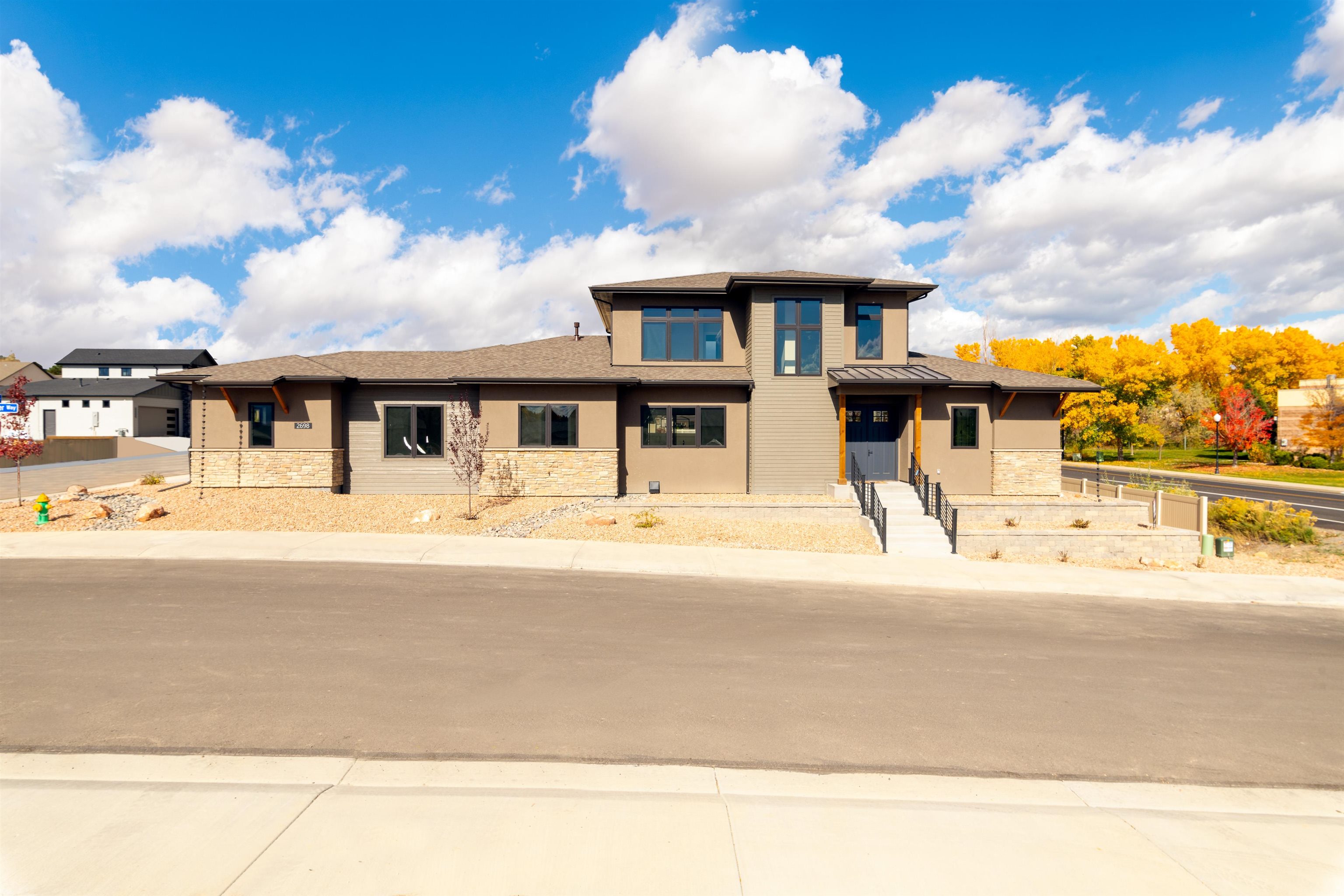 Looking for a custom built home with high end finishes? Look no further! The beautiful entrance leads to an open concept with 10' ceilings and amazing views. The kitchen won't disappoint w/ 6 burner gas stove, large pantry and views from the kitchen sink! Quartz countertops throughout the home and hand-picked tile in the bathrooms and laundry room. Walk through the enormous sliding glass door and enjoy the covered patio with family & friends. Primary offers a gorgeous 5 piece bathroom and walk-in closet. 4th bedroom/office on the main and a large mud room featuring built in shelves. You will actually enjoy doing laundry in the oversized laundry room. Upstairs bonus room has oversized window with spectacular views along with 2 bedrooms and full bath. Fully landscaped with a 3 car garage has Leev Box for deliveries.