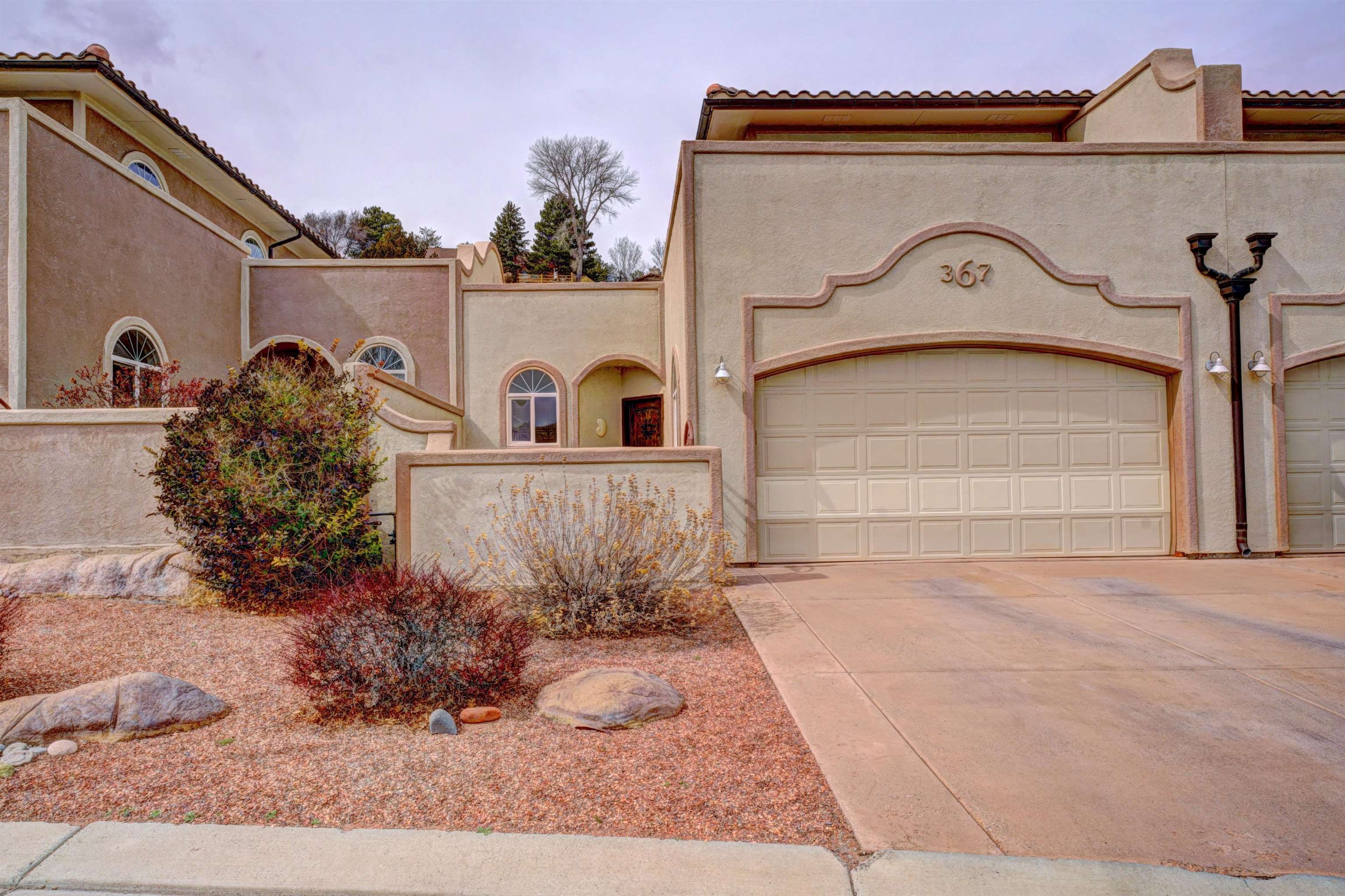 Surrounded by gorgeous rock formations in the backyard, and views of the Bookcliffs from the front balcony, this beautiful, well-kept, lock-and-leave property is perfect for anyone looking for an affordable home in the highly desirable Redlands area. It's a dream home for people who love hiking paths, mountain biking trails, and nearby parks, as well as those looking for low maintenance living. Featuring an open concept kitchen, dining, and living area, 2 bedrooms, a 2-car garage, and lovely gas fireplace. Schedule your personal showing today!