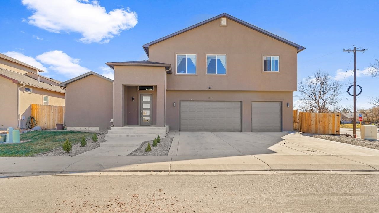 Situated on a corner lot in Fruita’s Pinedale Estates, this two-story stucco home has generous space inside and out! Step inside the home’s main floor where a spacious great room offers ideal entertainment space at the extensive kitchen island or dining room. Enjoy the high ceilings, natural light, and gas log fireplace in the home’s living room. From the great room, you’ll appreciate the backyard living and entertainment space which includes a covered patio, extended deck, hot tub, dog run, RV parking, and privacy fence. The primary suite is located on the main floor and presents a 5pc en-suite bathroom along with a walk-in closet. Rounding out the main floor is the home’s 2nd of 4 bedrooms, a full bathroom, laundry room, and 3-car garage. Upstairs, you will appreciate the second living space in the home’s family bonus room with reading loft, 2 additional bedrooms and another full bathroom. Added bonuses include central air, irrigation system, and high-end water-filtration system!