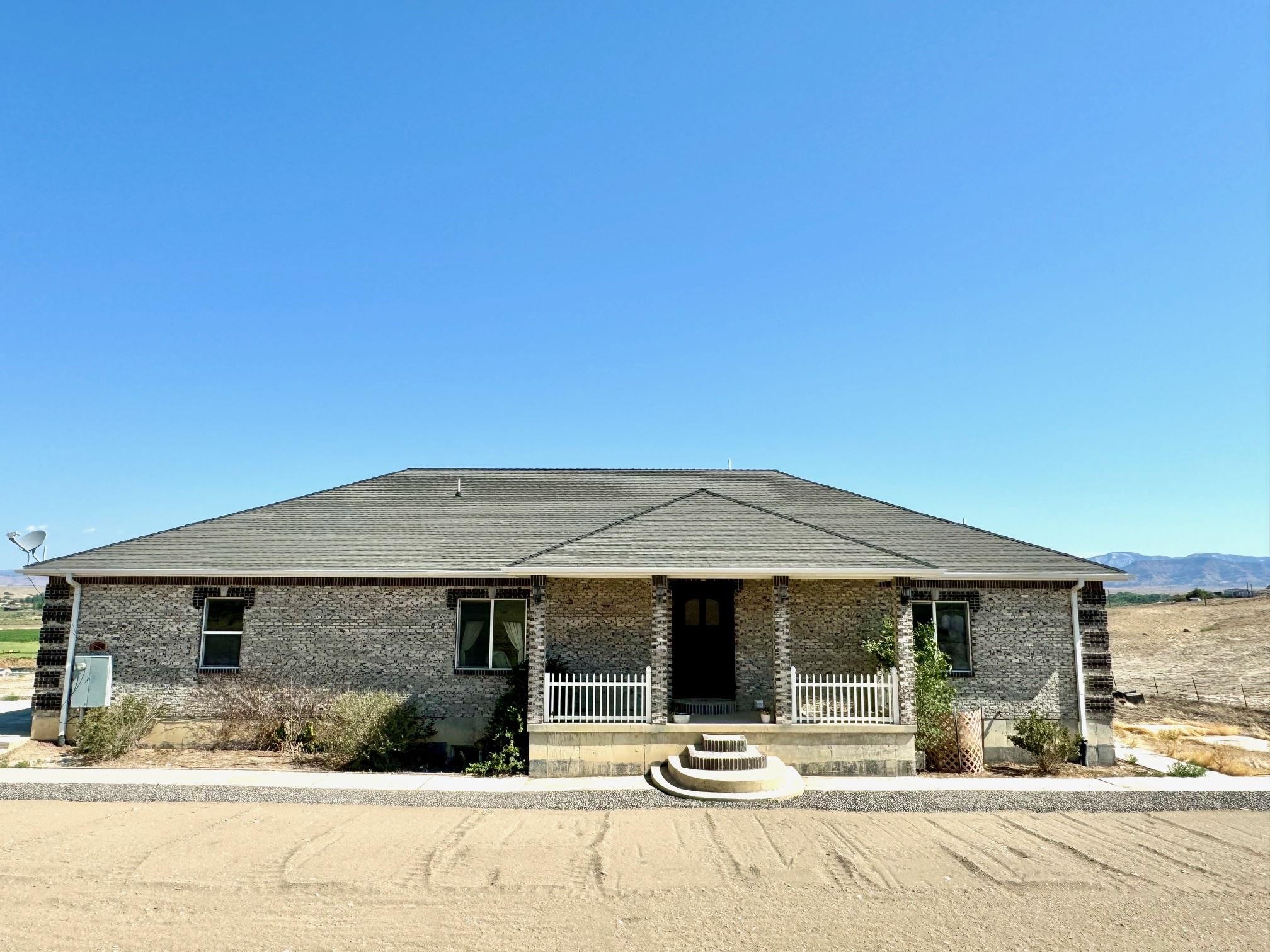 Come visit the only house with over 5 acres and 4000 sq.ft listed for under $900,000 in the Fruita/Loma area! This delightful 4100 sq.ft. ranch-style home with a walk-out basement, sits on over 5 acres of land, offering equestrian potential and space. Recently renovated, the main floor has an updated kitchen with the convenience of a concealed pantry and new fixtures and flooring in most areas. The lower level has a stunning master suite complete with a spacious bath featuring a luxurious walk-in shower, soaking tub, and an extremely large closet. The lower level also includes its own laundry room and an additional living space and kitchen, presenting an opportunity for supplementary income. This charming residence has two master suits, 5 bedrooms total with 5 bathrooms, dual laundry facilities, a walk-in safe, instant hot water in the kitchen and more. This home also includes a oversized 3 car heated garage.  Embrace the vast potential of this acreage and beautiful home.
