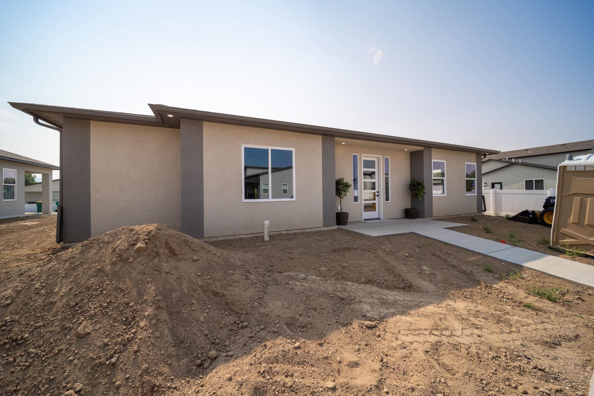 Walk into this beautiful home into an open concept floor plan with a split design. It has 3 bedrooms, 2 baths, and a 2 car garage and is located in the heart of Fruita's Iron Wheel Subdivision. This property will come with RV parking, fully landscaped front and back yard and a large covered patio that will give you great space for entertaining or simply enjoying your own private back yard. You'll enjoy the convenience of nearby parks, schools, and the charming amenities of downtown Fruita. Embrace the perfect blend of style and functionality in this contemporary gem.